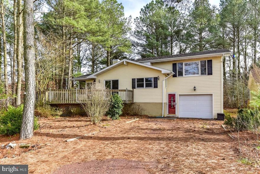 This home is located in a great location of Ocean Pines.   Featuring an attached garage,  4 bedrooms and 3 baths.   The large open floor plan with a cathedral ceiling is great for entertaining,  the kitchen has beautiful maple cabinets with an island and open to the spacious dining area.  Relax and enjoy the screened porch and open decking this summer.  Lots of storage under the house, plus attic and shed.  Many community amenities.This new listing won't last long,  call today for a private showing.