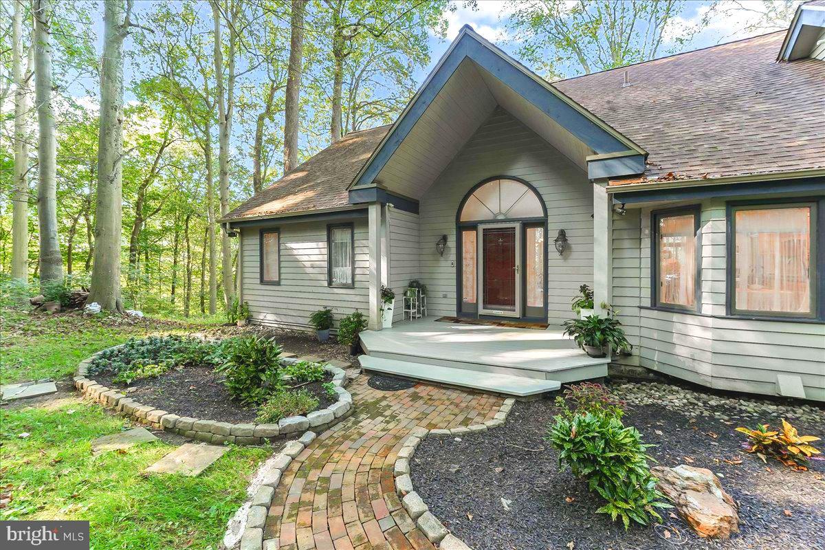 A beautiful parcel of land will be coming soon to the Real Estate market. Contemporary Hillside Retreat on 1 acre of land. This updated hillside home is designed for those who appreciate both modern amenities and the serenity of nature. The 4-bedroom, 3.5 bath offers a first floor primary bedroom, with two walk-in closets, a vaulted ceiling, and bath with double sinks and a spacious walk-in shower. The first floor offers plenty of natural light with hardwood floors, an open concept living area perfect for entertaining, with patio door leading to a large composite deck where you can relax and enjoy the seasons. The kitchen is equipped with modern conveniences, granite countertops, an island cooktop and ample cabinetry. The first floor features a laundry room and a oversized two car garage with openers and Tesla chargers. Added features, a two-story foyer that leads to the loft, an ideal space for an office, as well as a bedroom and a full bath or an additional bedroom. The lower level you will find a fireplace, two additional bedrooms, a bonus room , a full bath, and access to the second deck with view of trees, natural birch possibly 100+ years old. The home sits in a cul-de-sac, has a stream across the street, close to White Clay Reserve for hiking, and beautiful views of farmland with fields of crops and beautiful cows. You will love living in Broad Run we have the best of both worlds country living with easy access to local places of interest, shopping, restaurants and I95. I know I live in the area too.