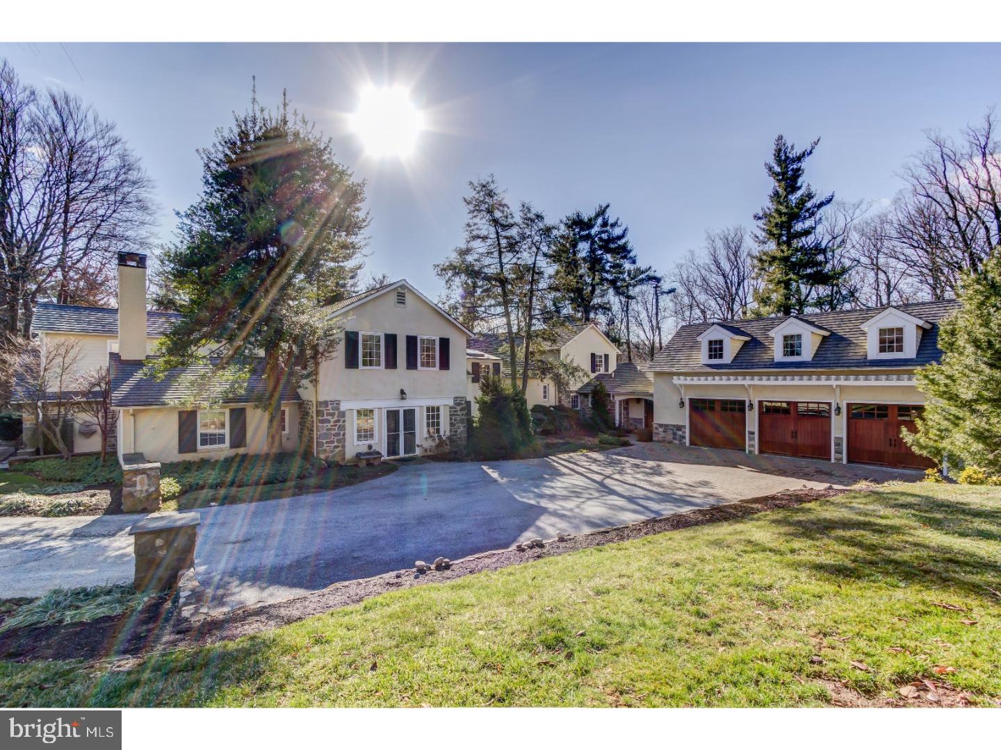Come fall in love with this unique, very special estate set down a long private driveway on an idyllic 2.38 acre property in Radnor Twp. This home has been significantly expanded to meet the discerning needs of today's buyers, while preserving the c.1940 farmhouse-style charm, with 6 fireplaces, random-width 5-8" wood floors, unique hand-crafted wood staircase, and 8" baseboard moldings. Extensive Peter Batchelor-designed additions include a stunning post & beam Family Room with see-thru wood-burning fireplace to the gourmet Kitchen, expanded Master BD suite, and a 3-car Garage with Bonus Room. This 5-6 BD, 5/2 BA home includes a separate 1st floor in-law/au pair suite with Den w/fireplace, Bedroom area, full BA, and bonus room that could become a Kitchenette. The main house has 4 BD upstairs, including a Master BD with fireplace, renovated marble master BA w/deep freestanding tub & radiant heat floors, and a huge walk-in closet with enough built-ins to please Carrie from Sex in the City. The Bonus Room over the garage is an ideal Rec Room, but also has a Murphy Bed, full BA, and Kitchenette. In addition to the gracious formal Living and Dining Rooms, the 1st floor also features a private Study, Billiard Room, 2 Pantries, & 2 Powder Rooms. The rear Hall/Mudroom has stone flooring with radiant heat, multiple closets, doors to front & rear porches, garage, and steps to the Bonus Room. The fireside Kitchen/Breakfast Rooms have 6-burner Thermador range w/griddle, 2 dishwashers, SubZero frig, icemaker, separate beverage frig., large island, wet bar, and granite counters. In addition to the Master Suite, the 2nd floor has BD 2 w/ensuite BA, BD 3 & 4 w/shared BA, large Laundry/upstairs office, and a balcony. A main floor gallery opens to a side flagstone patio, sparkling pool, and outdoor stone fireplace. An awning covers part of the patio, allowing it to be used as a wonderful "outdoor room" during warm weather. The rear yard has level, open, grassy lawn for recreation and backs to scenic woods. Convenient to train stations, universities, parks, schools, Center City, Airport, and the charming shops & restaurants in the village of Wayne, this property is an unexpected delight which is well worth the visit.