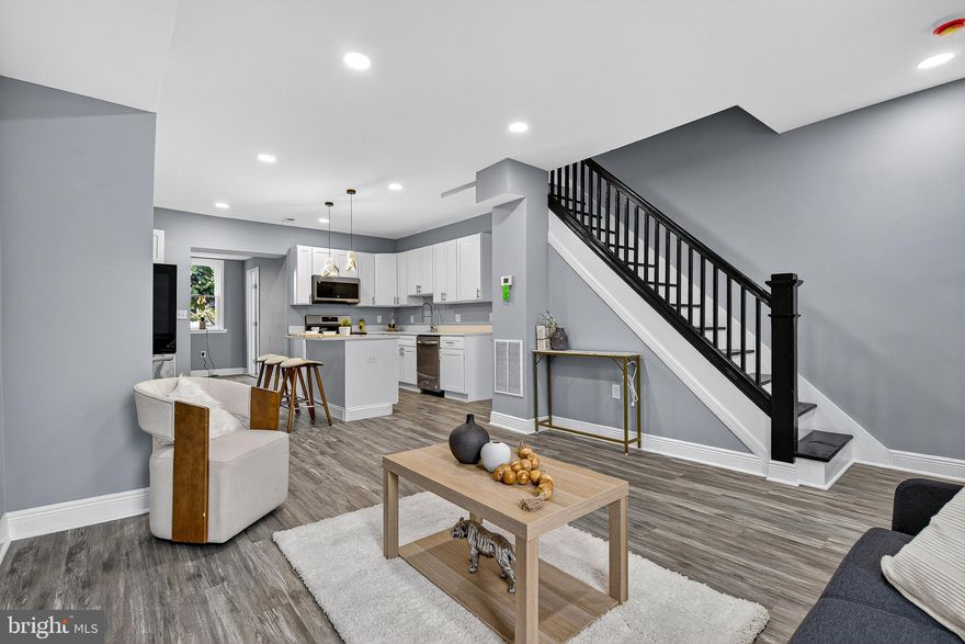 Welcome to this beautifully renovated brick townhouse with a great location,  perfectly blending charm with modern upgrades. From top to bottom, this home has been completely transformed and is move-in ready. Step onto the inviting front porch and into an open-concept main level featuring a stunning kitchen with brand-new cabinets, quartz countertops, and stainless steel appliances, full bath, recessed lighting and new flooring throughout. With 4 bedrooms and 2 fully renovated bathrooms, there’s plenty of room for comfortable living. The fully finished basement includes a separate walkout, the 4th bedroom, and laundry hookups—perfect for guests or a private retreat. This home also features: New HVAC system, new windows, new electrical and plumbing systems, New main water line, Modern fixtures and stylish finishes throughout. Don't miss out on a property built to last. Schedule your showing today!