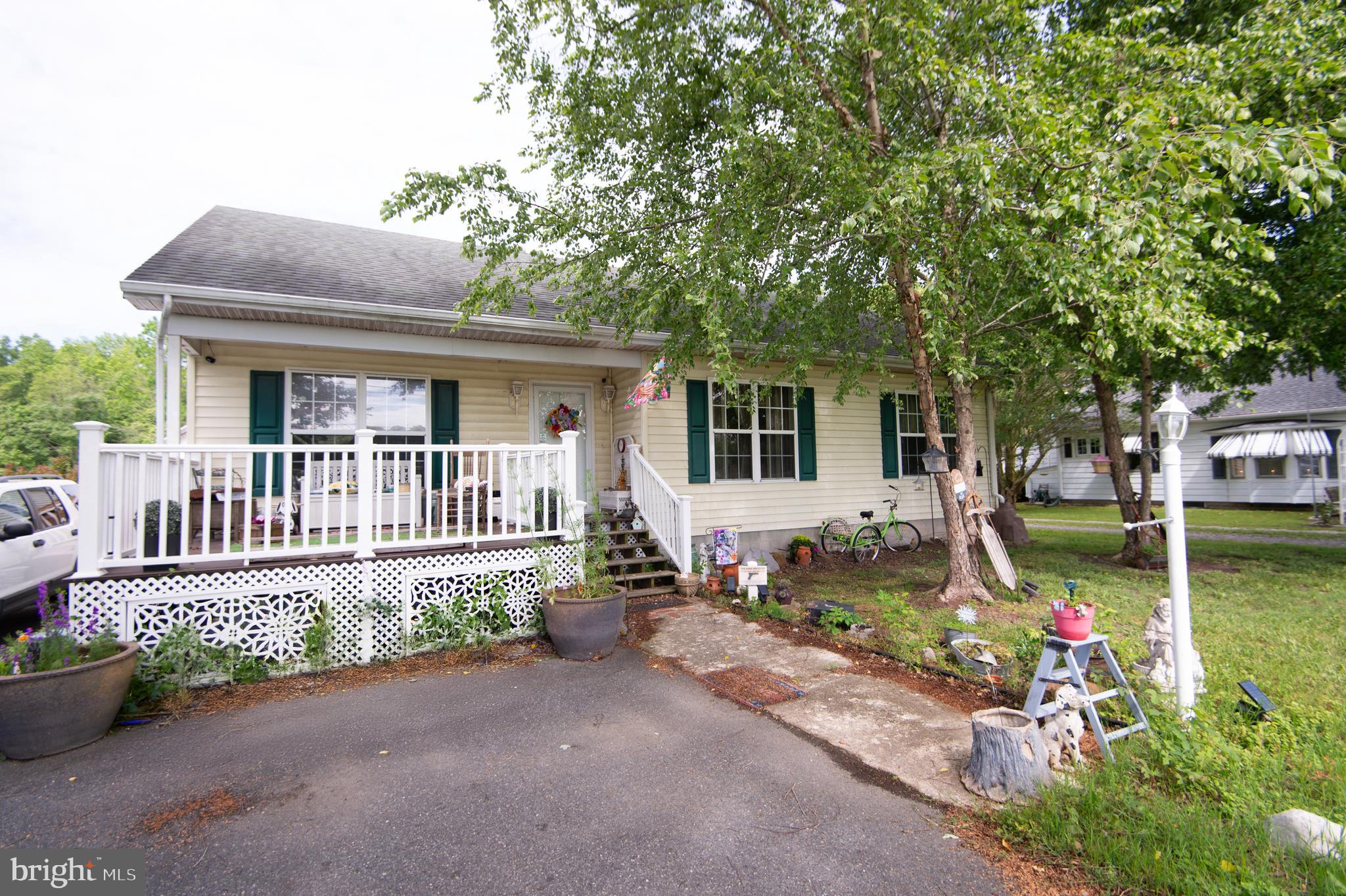 This newer rancher has a great location! It needs just a little cosmetics to make it your own. There is a paved driveway and nice front porch and deck. Sliding door from dining area opens to a large rear deck and completely fenced backyard for pets or children. There are two large sheds as well. One has electric and is finished; the other has all materials (drywall, insulation) to finish that convey with the property. There is an on demand water heater. Take a look today!