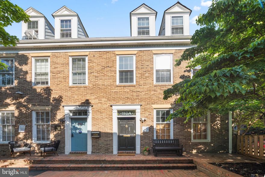 Welcome to Barrister Square! Tucked within a private courtyard just steps from vibrant King Street, this sun-drenched 4-level end-unit brick townhouse offers exceptional versatility in one of Old Town Alexandria’s most sought-after locations. Configured as two separate 2-level residences and currently operating as a popular short-term rental, this unique property presents an outstanding opportunity for owner-occupants, investors, or live/work buyers. MORE PHOTOS , Property Details at Residential Listing VAAX2059284. 
Extensively renovated in 2022, the home features stylish modern finishes throughout, including updated baths with designer tile and fixtures, high-end lighting, in-unit Miele washer/dryers in both residences, separate HVAC systems and water heaters, hardwood floors across three levels, luxury vinyl plank flooring on the lower level, oversized windows, soaring ceilings, skylights, custom transoms, and a striking spiral staircase that adds architectural character and connects the upper residence to the loft level.
The upper residence features a full kitchen with island seating, granite countertops, spacious kitchen and dining area with soaring ceilings and skylights, a large bedroom with sitting area, main-level half bath, loft-level family room with built-ins, an oversized second bedroom beyond a custom sliding door, and a full bath with walk-in rain shower.
The main/lower residence offers two spacious bedrooms, including one with ensuite half bath, the other a Murphy bed, along with a full bath featuring a walk-in rain shower. The flexible lower level includes a kitchenette, built-in banquette dining area, fireplace lounge, separate flex space, second half bath, and laundry.
Outside, the charming, shared courtyard framed by mature trees and garden beds creates a peaceful retreat just moments from King Street’s acclaimed restaurants, boutiques, waterfront, Metro, commuter routes, and the free King Street Trolley.
Commercial Low zoning offers exceptional flexibility for residential, live/work, office, or rental use. An exceptional Old Town offering blending architectural character, flexibility, and investment potential in a premier location.
*Available furnished via separate arrangement with seller. Furnishings are personal property excluded from the real estate transaction.