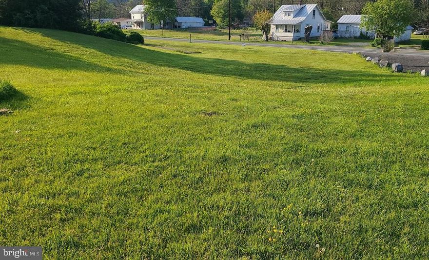 Nice building lot located along US Rt 33. Public water access. Close to small town amenities. A perfect location just minutes from National Forest, Brandywine Lake Recreation area where you'll find hiking, biking, swimming and fishing, 40 minutes from Harrisonburg, VA and  less than an hour to Seneca Rocks, WV Recreation area. Public water hookup & Electric available.
