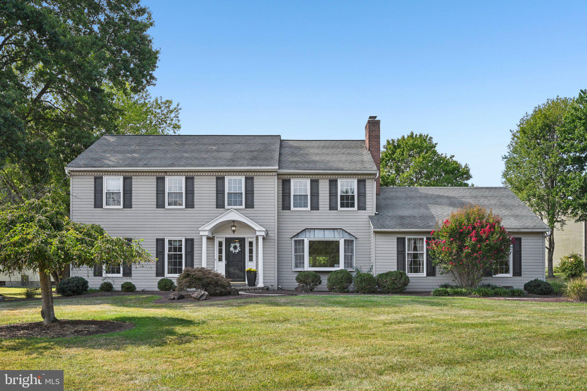 Homes in Lockwood Chase rarely come available. This 4-bedroom, 2.5-bath Colonial sits proudly on a corner lot in Malvern, offering space, function, and timeless appeal.
Step inside to find a traditional floor plan designed for everyday living. The hardwood foyer opens to a formal living room and a spacious dining room with classic wainscoting. The updated kitchen features a pantry, crisp white cabinetry, a center island, and stunning Taj Mahal quartz countertops. It flows seamlessly into the family room, where a brick fireplace sets a warm focal point. Just beyond, the vaulted sunroom provides endless options for a den, bar area, or playroom. From here, sliding glass doors open to a generous deck with steps down the back yard. A half bath, large laundry room, and access to the 2-car garage complete the main level.
Upstairs, the primary suite offers a walk-in closet and a private bath with dual vanities. Three additional bedrooms share a hall bath, each with plenty of space and natural light. The finished basement adds even more flexibility with a recreation area, second bar, and abundant storage.
Outdoors, the flat yard and koi pond create a peaceful setting, perfect for entertaining or simply relaxing.
All of this in a sought-after neighborhood, just minutes from Routes 352, 202, and 30, and within the award-winning West Chester School District. A rare opportunity to own in Lockwood Chase.