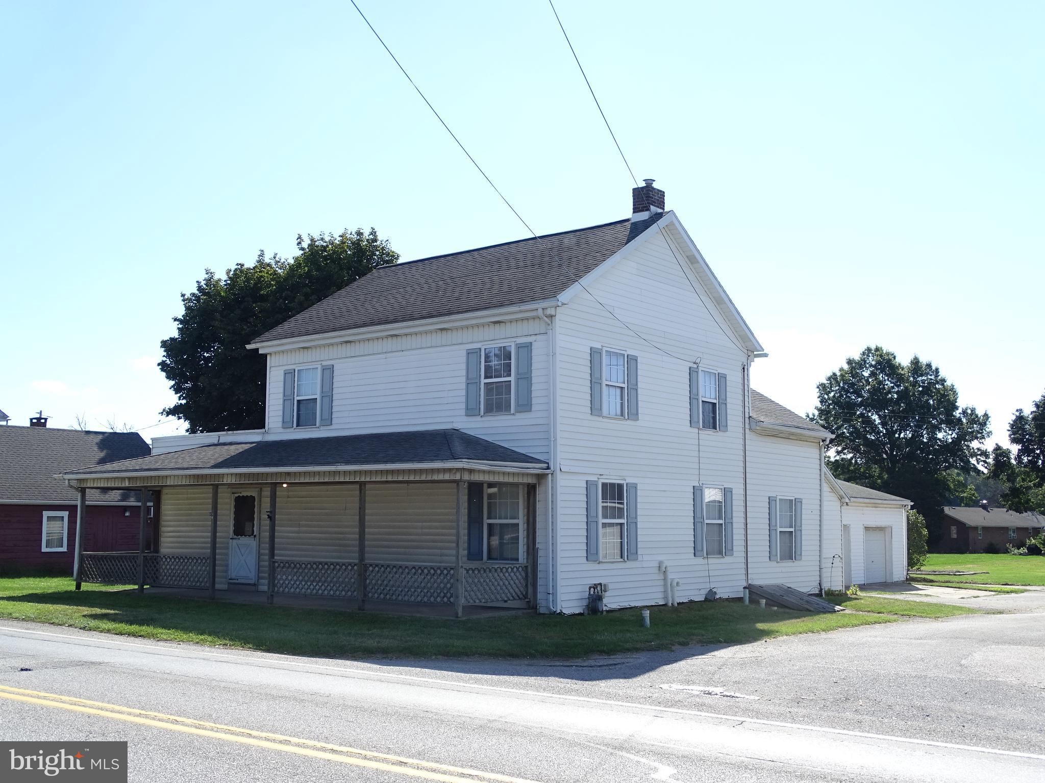 Remarkable Opportunity to own a 2496 sqft two story home on a .4287 acre level lot in spring grove schools. Formerly used as a country store, this home features 4 bedrooms, "one being a walk through bedroom", 2 full bathrooms, First floor Laundry room, First floor family room, 2 living rooms, Potential for a first floor bedroom, A very large 24X36 two car garage, large level back yard, Off street parking, Gas Heat, Gas Hot water, Public water and sewer, and so much more!!! Bring your imagination and build some sweat equity!!!