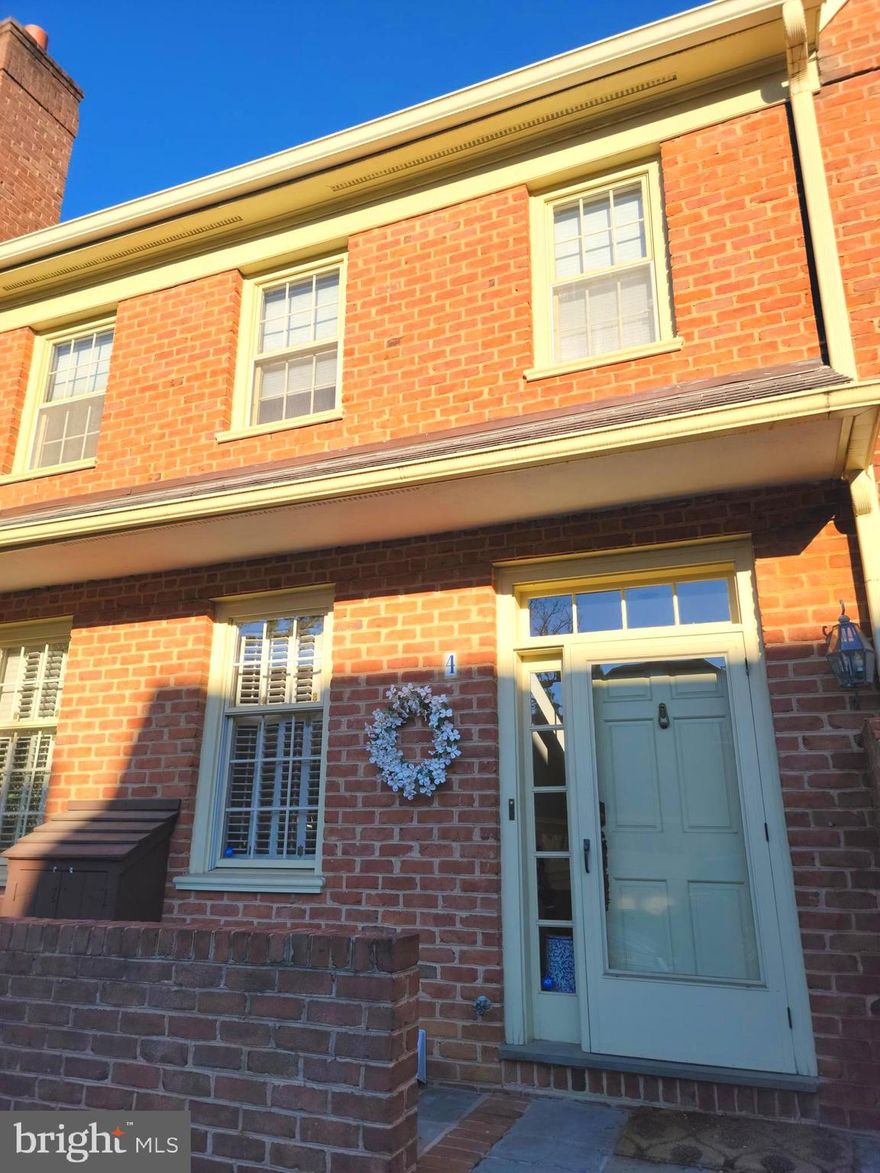 Come experience this lovely 3 bed 3.5 bath home nestled within the charming brick walls of Thatcher Court. Enter through the front door and immediately feel at home. The living and dining areas are complimented by beautifully finished hardwoods, large windows which provide plenty of natural light, and a fireplace surrounded by wood accented built ins. Through the dining room you will find the kitchen complete with built in appliances, a fireplace, central island with sink and dishwasher, and granite counters. Walk out the sliding glass door to find a your own private garden and patio. Upstairs you will find 3 spacious bedrooms with ample closet space. The 2nd floor holds two bedrooms with their own separate bathrooms. The master bedroom boasts a walk in closet, custom built in shelves, and whirlpool tub. The 3rd floor holds one more bedroom with private bathroom plus there is a bonus room historically used as an office. There is an elevator for access to all 3 floors plus basement for easy access to laundry and storage. The home has various storage options when factoring in the basement, garage, and closets throughout. Just a short walk to Suburban Square, regional rail, and downtown Ardmore. Also conveniently located close to the major roadways for easy access to Philadelphia and the Main Line. Schedule an appointment today!