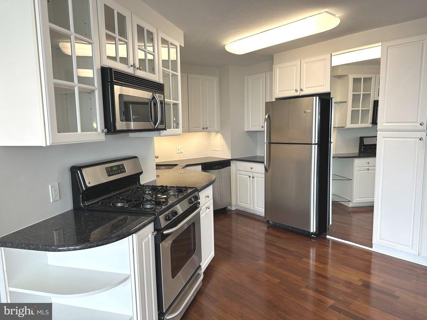 You will love living at Sutton Terrace! It is luxurious living with amenities,  friendliness and the feeling of being on vacation year round. This 1322 square foot 1 bedroom + den is mostly used as a 2 bedroom condo has 1 ½ baths and was reconfigured to enhance the openness of the condo.There is a 24/7 door person building with excellent support staff to help you with packages, groceries and other needs.  As you step into the property, there is a wide open space allowing you to see the entire wall of windows and views beyond. The gleaming dark wood floors are the perfect backdrop for elegant rugs. The property was just painted in designer colors and the bedroom/den are newly carpeted with lovely soft neutral colors. The handsome black granite countertops and white kitchen cabinets in the kitchen floor plan were redesigned to maximize the efficient use of the space. The slight curve and the way it is contiguous to the kitchen gives the dining area character.  It has windows for air flow on nice weather. The wall scones and dining room fixture provide subtle, soft lighting. There is a gracious flow of the dining room into the living room. The long end of the living room can be used as another sitting area or a dining area. The view from this 9th floor allows you to see over the treetops and the city in the distance. Take the hallway to the left, the den /2nd bedroom is on your immediate right with a full closet. The hall continues to a linen closet on the right and a big walk in closet on the left. The wash/dryer is on your left. As you walk ahead, the angled door to the bathroom leads to the enlarged bathroom. The long vanity and counter have plenty of storage. Look at that beautiful glass wall in the enlarged shower! This shower is easy to use and has so much space. The primary bedroom is roomy and has another wall of windows. The library and fitness center are on the first floor. The newly redecorated social room is used for meeting, speakers, playing cards, games and entertainment. The grounds have lush plantings and are well kept. A beautiful new fence was installed around the perimeter of the lot. The location of the building has easy access to the city, suburbs and airport. Shopping is right across the street. It is a beautiful neighborhood to live in with charming homes nestled close to mature trees and plantings. The pool is open to everyone for a $145 per member. The indoor garage spaces when available (currently available) are $150/month. There is a $2500 refundable move in fee after living at Sutton Terrace for 30 months. The condo fee is $1203/month which includes $879 monthly association fee + capital reserve fee of $143 + masonry loan of $146 until 2/28, and $35 for electric.