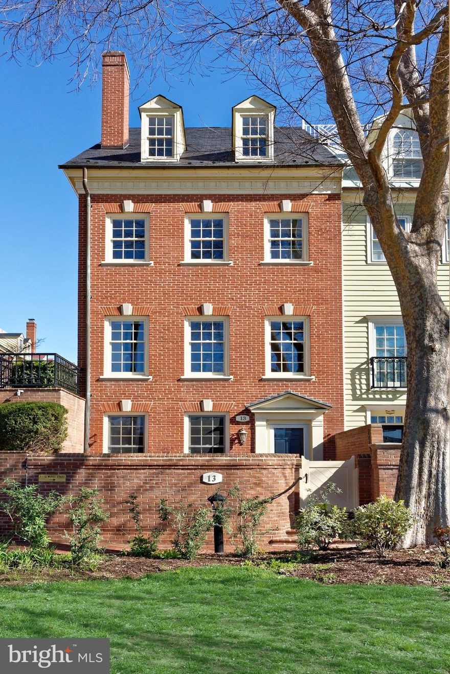 Impeccably-renovated single-family gem nestled in Old Town’s coveted waterfront community of Harborside! Absolutely beautiful and tastefully redone inside-out, this charming home showcases spectacular water views from all levels, plus has a lovely brick patio overlooking the waterfront park for private outdoor pleasure. Other desirable features include two deeded garage parking spaces for your vehicles, a full-floor primary suite with a private office, and light-filled top floor guest suite brightened by dormer windows.   On the main level rests a wonderful living room that’s perfect for lounging with loved ones. Gather around the gas fireplace with a new marble hearth and surround, flanked by custom built-in bookshelves designed by renowned cabinet maker, Jamie Nash. Or step outside to the large patio to enjoy alfresco dining, coffee/cocktails, and stunning water views. Off the living room is an elegant powder room with Scalamandre designer wallpaper, and a rear door that accesses the building’s parking garage.   One story above provides an ideal backdrop for entertaining with a formal dining room and renovated open kitchen. Enriching the dining room’s ambience is a second gas fireplace with a handsome mantle and custom built-ins, also by Jamie Nash. Chef’s quarters are meticulously appointed with quartz countertops, under-cabinet lighting, and stainless steel appliances.   Level two is reserved for the primary suite comprised of a tranquil bedroom with Scalamandre designer wallpaper, huge custom walk-in closet, second closet, and office space with river view. The opulent primary bath affords a spa-like experience with marble flooring, a dual-sink marble-top vanity, updated mirrors & lighting, and seamless oversized glass rain shower. In the hall is a convenient laundry closet with a washer-dryer.  The third/top floor is occupied by a generous secondary bedroom with premium carpeting, an expansive walk-in closet, custom built-in wardrobe, additional storage, and a renovated en-suite bathroom. All spacious closets in the home are customized by California Closets, and all baths are adorned with decorator tiles and stylish fixtures. Elevating the luxury further are hardwood floors on three levels, refined finishes throughout, classic moldings, a new marble entrance, sophisticated neutral stair runners, and premium Marvin windows. All at a prime address moments from the Potomac River, green spaces, restaurants and more!