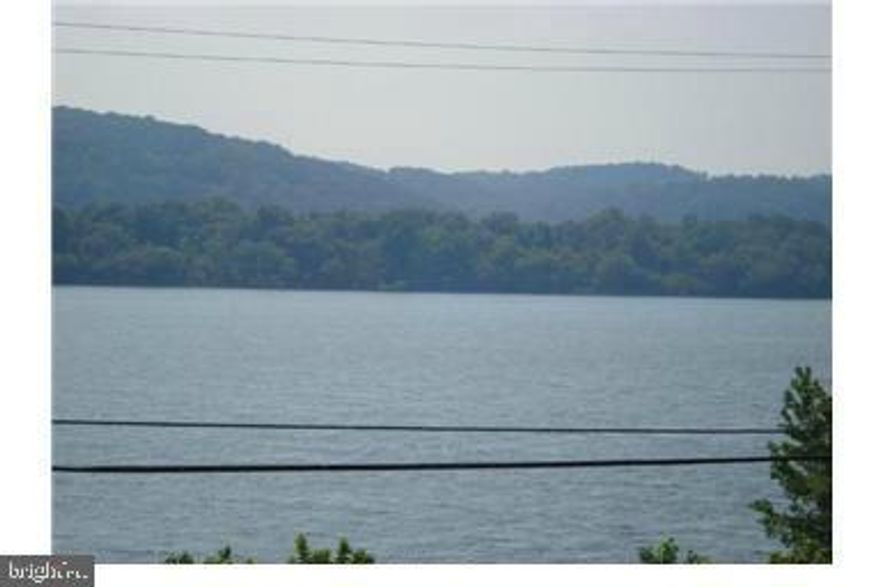 Enjoy the summer  months on the roof deck overlooking the Susquehanna River. Walking distance to the library, post office, parks, and many restaurants and bars. Within a 5 min drive you'll find parks, fishing, kayaking, boating, shopping, casinos, and the Great Wolf Lodge. as is . needs some TLC. Port Deposit. one block from water. Granite counter tops in kitchen. Being sold AS-IS