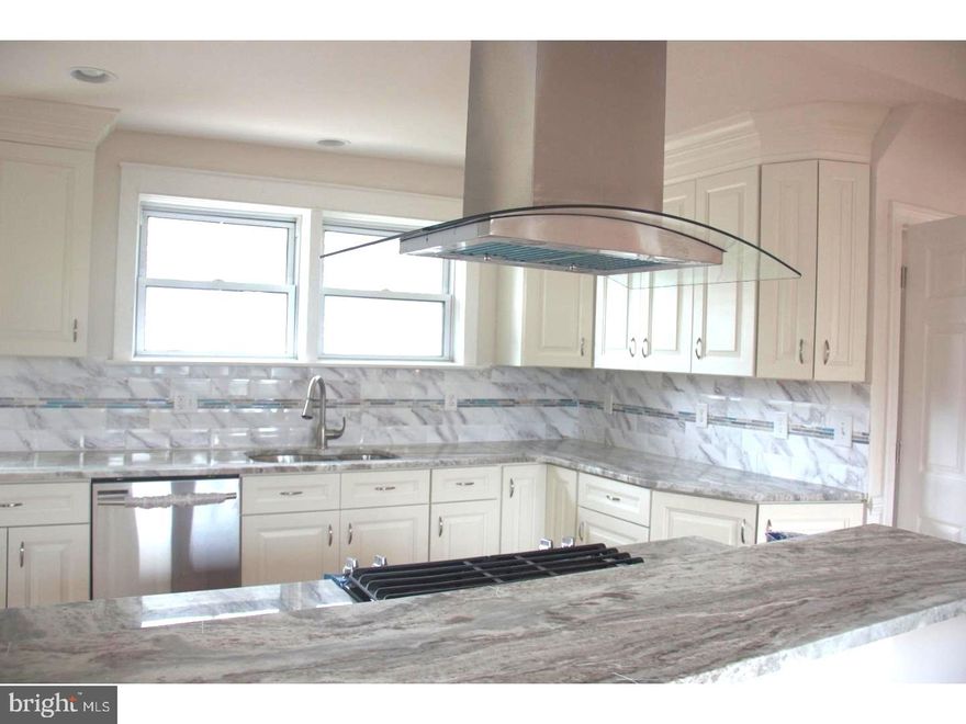 Beautifully renovated home in desirable  Havertown community.  This corner property has an open floor plan, with gorgeous hardwood floors, large gourmet kitchen with stainless appliances and gas cooking, breakfast bar open to formal dining room.   Gracious and spacious open Living Room with fireplace, also bathed in light. and access to deck and rear fenced yard.  Second floor:  fully carpeted three bedrooms with updated bath.  Third floor:  Master bedroom with an amazing updated full bath.  Lots of storage and closets.  A finished basement with laundry and washer/dryer, plus access door to rear.   All appliances, C/A, and one (1) car garage (lower level) and additional parking.  Available March 1, 2025.