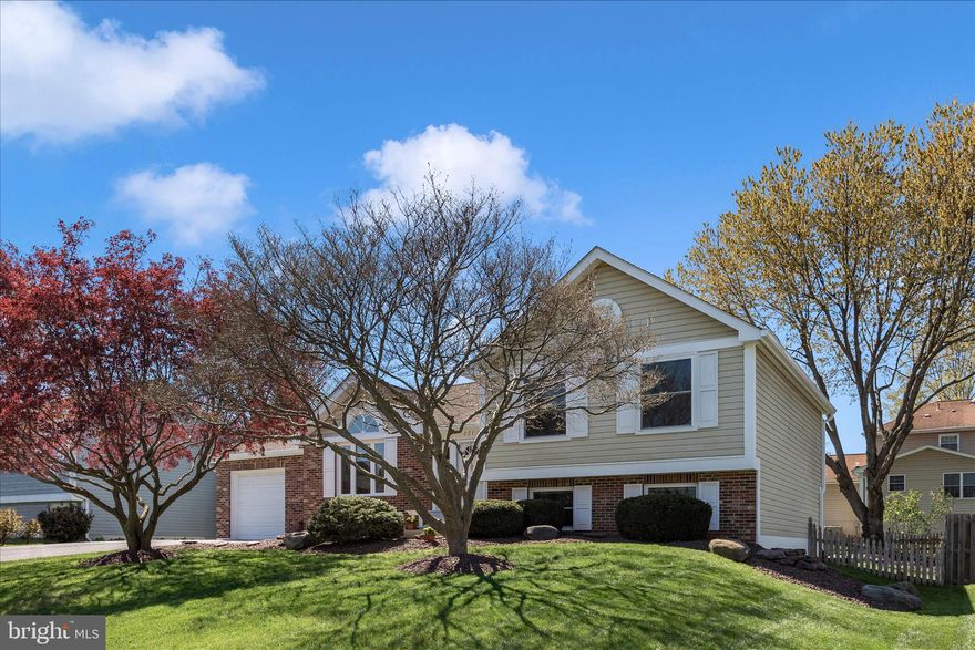 Meticulously maintained by owner of 35 years, this 4-level split offers exceptional curb appeal and pride of ownership throughout. The impeccably manicured lot sets the stage for this bright and sunny home featuring vaulted ceilings and hardwood floors on the main level.
Upstairs, you’ll find three bedrooms, including a primary suite with an ensuite bath and thoughtfully designed closet organizers. The spacious lower-level family room is perfect for family time, complete with a cozy wood-burning fireplace, powder room, laundry area, and direct access to the fully fenced backyard. The basement level is clean, dry, and offers abundant storage or potential for future expansion—all shelving conveys.  Freshly painted in designer colors, the home feels crisp and move-in ready. Enjoy peaceful mornings or evenings on the screened-in rear porch  with mature, recently pruned trees. Oversized garage offers even more storage space with built-in shelving. Major updates include: new windows (2021, excluding basement), brand new gutters with gutter guards (2026), hot water heater (2024), HVAC (2013), roof (2007, 30-year warranty), refrigerator (2025), and washer/dryer (2022). The hot tub was professionally shut down in 1996 and was operational at that time.
Every component of this home has been regularly maintained—and it shows. Absolutely spotless.
Located in a USDA-eligible area with a low HOA of just $50/year. Conveniently close to all shopping, Heritage Farm Park, the library, and Glade Elementary.