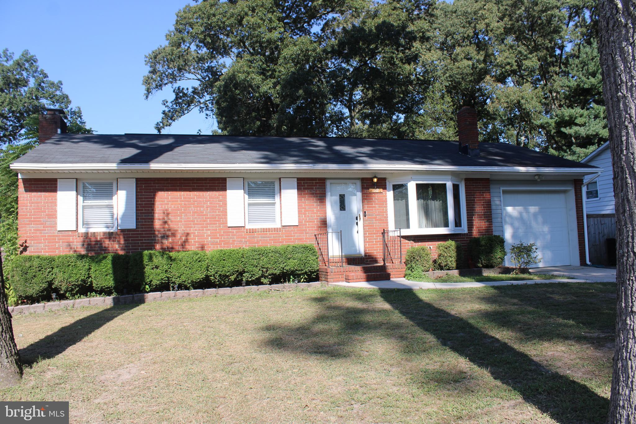 Welcome to this charming 3-bedroom, 2-bathroom Ranch/Rambler in the desirable Magothy Forge subdivision. Situated on a large lot, this home features a comfortable living room, a dining room, and an enclosed sunroom with skylights for abundant natural light. The master bedroom offers a secure wall safe for your peace of mind. The expansive backyard is equipped with storage sheds, playground equipment and above ground Garden Beds. The partially finished basement with a fireplace presents a fantastic opportunity for you to add your personal touch. downstairs bathroom and shower needs to be finished. Residents have the option of joining a voluntary Home Owners Association for access to a community boat ramp. The home also features a 1 car garage with additional driveway space for 6 cars. Located just minutes from shopping, restaurants, and other conveniences, this home is built for both comfort and entertainment.
