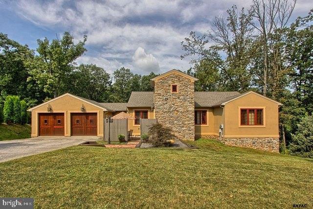 Large open floor plan with kitchen, dining room, living room 29'7" x 29'7" and tile floors thru-out up & down wood staircase to lower level with wine, theatre room & family room area. 3 patios see association docs for more details. 2 car garage, gas heat, central air. Home has great presentation. Custom doors and more.