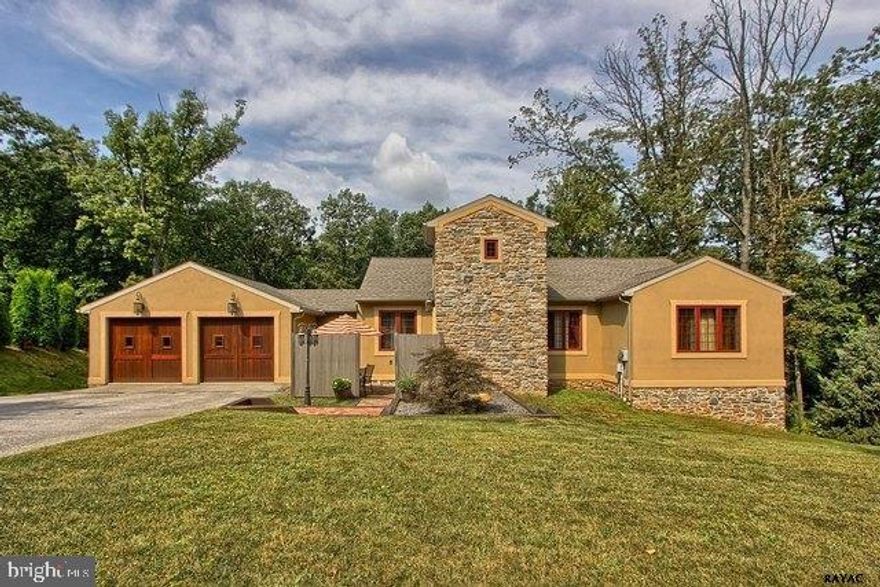 Large open floor plan with kitchen, dining room, living room 29'7" x 29'7" and tile floors thru-out up & down wood staircase to lower level with wine, theatre room & family room area. 3 patios see association docs for more details.  2 car garage, gas heat, central air.  Home has great presentation. Custom doors and more.