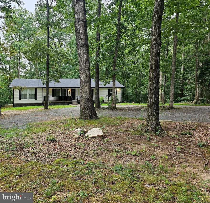Beautiful home located on 5 ac.  Over 30k in hvac replacement , washer/dryer, water heater, water softner system, security system 2024.  Newer roof replaced prior to current owner purchase.  Serene nature and views of trees and forest.  This home sets back from the street and contains a circular gravel driveway with 2 entrances from the road.  A second driveway leads to the side of the home for garage access.  Enter this home from the covered front porch.  The front door leads to the living room with a shiplap accent wall.  From the living room the open floorplan leads to the dining room and kitchen area.  The kitchen with laminate cabinets are constructed with dovetail cabinet fronts.  The countertops are a neutral quartz with corresponding tile backsplash.  The stainless steel appliances also include an undercabinet beverage center and lower cabinet built-in microwave.  The gourmet kitchen contains and peninsula island with counter overhang perfect for bar stools.  The family room is open to the kitchen which makes it perfect for entertaining.  The family room has an electric fireplace with mantel.  No need to carry in those wood logs to enjoy a cozy fire.  The family room has a closet with access to the attic storage.  The hall full bath has luxury vinyl tile flooring and shower tiles to the ceiling.  The shower also contains a shower niche for your hygiene products.  The primary bedroom also on the main level has views of the rear yard trees and forest.  From the primary bedroom you enter the connecting full bath with luxury vinyl tile flooring and shower tile to the ceiling.  The shower also contains a wall niche for hygiene products.  Bedrooms 2 and 3 are also located on the main level.  The main level also includes luxury vinyl plank flooring.  The lower level has wood stairs leading from the main level.  The rec-room is expansive and is a walk-out to the rear yard.  There is a large bedroom 4 on this level and a full bath with walk-in shower which also has custom tiling on the floor and shower surround.  Two utility areas are located in the lower level.  A bonus room which would be great for a home gym contains tile flooring and has access to the garage.  The home has a water treatment system and contains an HVAC system that was installed in 2024. MINIMAL QUALIFICATIONS are: gross monthly income x 3 = the monthly rent, credit score 740 or better for all applicants.  No more than 2 incomes may be used for qualification.