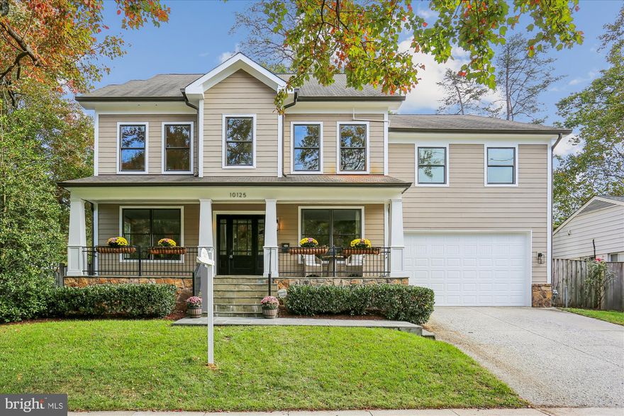 Welcome to this special home located just minutes from NIH, Walter Reed Medical Center, 
downtown Bethesda, I-495, and I-270. Ideally sited on a corner lot across from the 
entrance path to Rock Creek Park, the home is framed by mature trees and features an 
elevated stone-accented front porch that sets the tone for the craftsmanship inside.

Step into the main level and you are welcomed by a stunning great room with a soaring 20-
foot coffered ceiling, dramatic picture windows that flood the space with natural light, and 
a natural stone gas fireplace that anchors the room. The open floor plan connects 
seamlessly to the gourmet kitchen, where Viking appliances, a large center island, custom 
Kraftmaid cabinetry, and generous eat-in space make everyday living and entertaining 
effortless. A butler’s bar with wine fridge and a functional mudroom off the true two-car 
garage add convenience, while the dining room, a bright separate living/music room, and a 
private office with oversized windows provide both formal and flexible spaces. A powder 
room and a laundry room with a new washer/dryer (2023) complete this level and sliding 
glass doors open to a beautifully hardscaped patio with custom stonework, firepit, and 
private hot tub area, all within a fully fenced backyard.

Upstairs, the primary suite is a retreat of its own with vaulted ceilings, a separate sitting 
area, and not one but three walk-in closets. The spa-inspired bath showcases floor-to ceiling stonework, a large shower, separate jetted soaking tub, dual vanities, and a private water closet. Three additional spacious bedrooms complete the second floor: two share a Jack-and-Jill bath while the third offers its own en-suite bath and walk-in closet. 

The third floor reveals another large and bright bedroom suite with a giant walk-in closet and private 
full bath, ideal for guests, an au pair, or a teen retreat.

The walk-out lower level is equally impressive, with a sunlit entertainment space anchored by a custom stone wet bar, a dedicated movie room with a giant screen, and a large guest bedroom with yet another oversized walk-in closet and full bath. Multiple storage areas provide room for everything.

Built with extremely solid construction and designed with thoughtful details, the home features true hardwood floors throughout, double staircases, crown molding and nine-foot ceilings on every level, natural stone finishes in every bathroom, central vacuum (including in the garage), an alarm system, and fresh paint throughout. With seven walk-in closets and endless storage, the home blends high-end luxury with practical everyday living.

From the stone-based front porch to the fully fenced yard with gates, firepit, and hot tub retreat, this property is as remarkable outdoors as it is inside. With its blend of timeless craftsmanship, exceptional design, and an unbeatable location, this Bethesda home is truly a must-see!