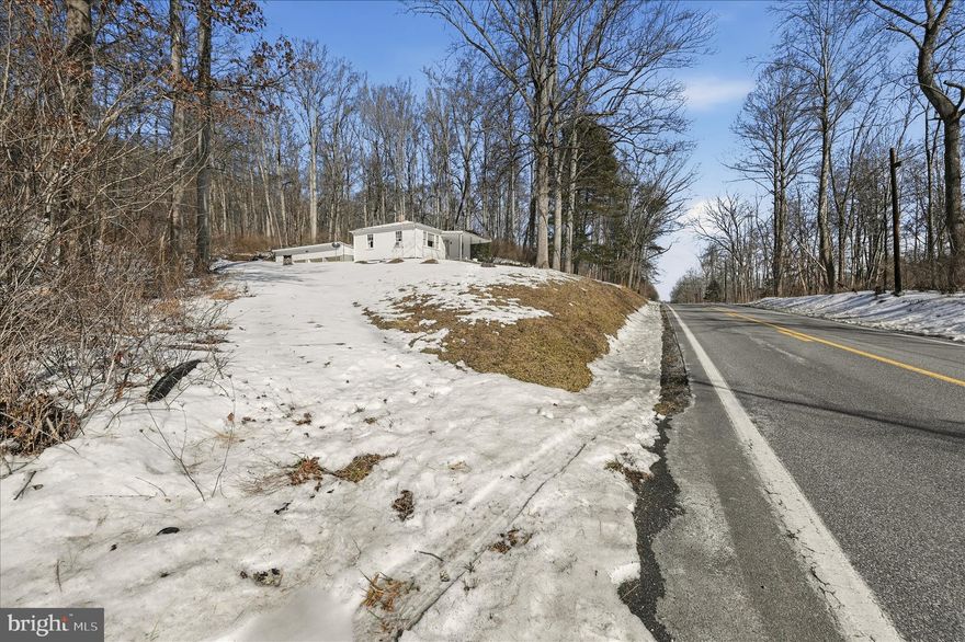 This unique listing includes two parcels totaling approximately 16+/- acres, offering a rare opportunity to create your ideal retreat. The property features a large, detached garage and expansive, private surroundings. The existing home is considered a tear-down and is being sold as-is with no value assigned, making this an excellent canvas to build your dream home in a peaceful, secluded setting.