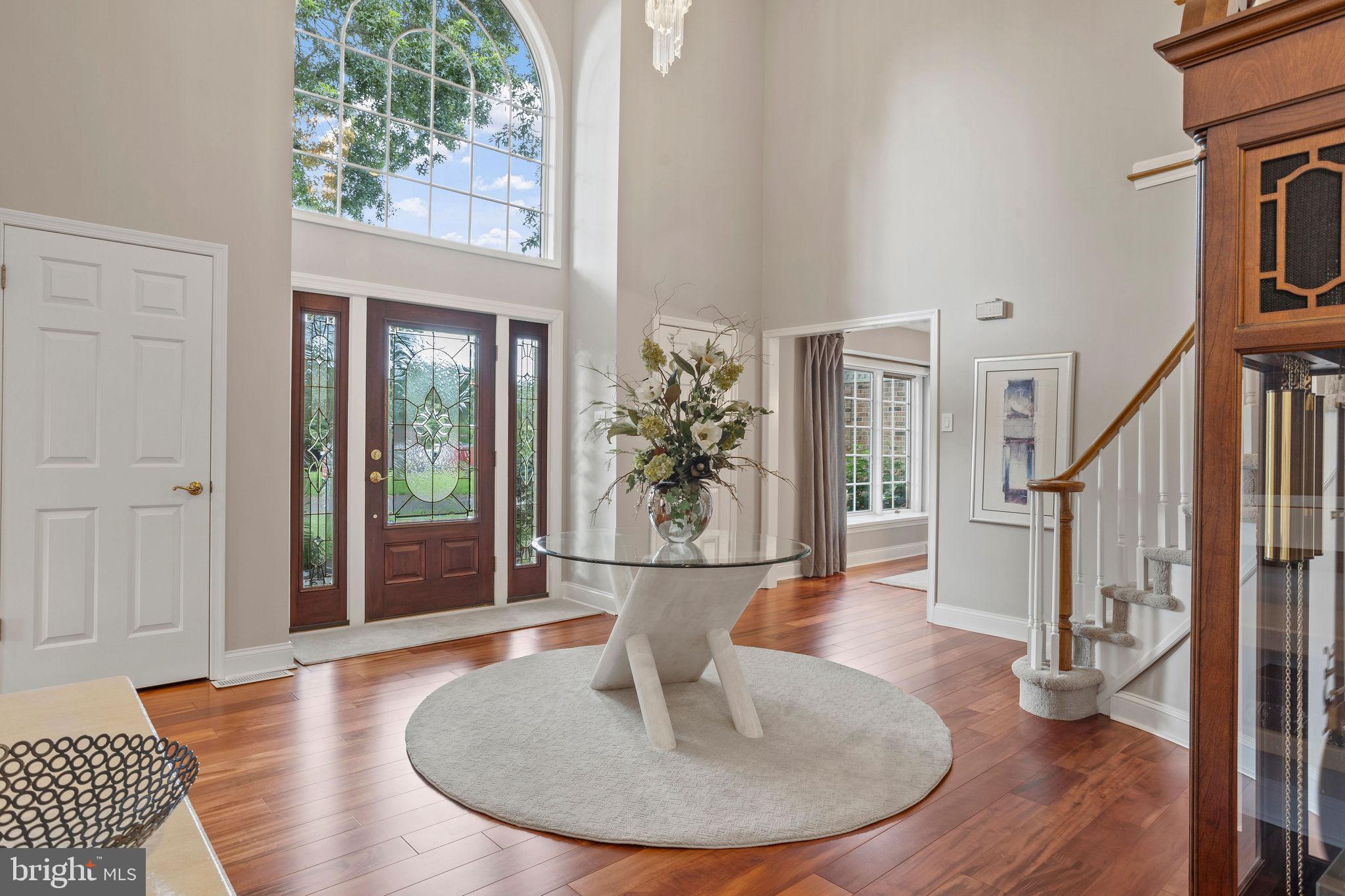Stunning, sophisticated and superbly updated! This extraordinary home is in the sought-after Hidden Cove Estates and this is the first time it has been offered for sale. Here you will find custom features and designs of the highest quality materials, products and workmanship. A wonderful floor plan matched by the beauty of the designs and décor, it is both luxurious and comfortable with an extraordinary ambiance. A stately brick exterior, almost an acre of land, exquisite landscaping, and in move-in condition, it will delight you from the time you enter into the elegant foyer and walk through the three levels of space. It is a visual delight and the character and ambiance of this gracious home is evident and palpable. From the large formal living room and dining room, you enter the showstopper gourmet eat-in kitchen. Custom made maple cabinetry, a uniquely designed island with seating, granite counters, walk in pantry and beautiful backsplash, a serving area in the casual dining part, and a sliding glass door with custom maple plantation shutters leads to the patio and backyard. The family room has a custom designed cherry wall of built-ins that surrounds a decorative fireplace (easy to install a propane insert). It is a beautiful focal point of this home and has another sliding door to the patio. To enhance the beauty of the cherry wood, Brazilian tiger wood flooring was installed in the living and dining rooms and the foyer. Gorgeous! A powder room and laundry room with a storage closet completes the first floor. The curved staircase takes you to the second floor with four spacious bedrooms, two outstanding bathrooms and a wall of storage closets. The primary bedroom suite is a large and serene retreat with a spa-like bathroom that has an 18’ vaulted ceiling and a beautiful freestanding soaking tub. The cares of the day and the world will melt away. Three other large bedrooms (one now used as an office) have ample closet space and the hall bath is another visually stunning design. The basement level is newly refinished and two Japanese gambling games by Mizuho are embedded into the wall. Fun! An oversized 2-1/2 bay garage has a door to outside and another to a staircase to the basement. It also has a pulldown access to a storage area. The rear EP Henry paver patio is surrounded by incredible landscaping that also surrounds this home. It is a potpourri of color, texture, and beauty. The birds can be heard singing constantly and the huge, level rear lawn area is an open slate for your vision. Visually stunning, solidly built and maintained, light and bright interior, this is not just a house. It’s a home that will delight and welcome you every time you return. The finest in shopping, dining, parks, cultural activities, and commuting routes to Philadelphia, Princeton, and New York are nearby. Also, Award Winning Council Rock. This could be your own slice of perfection. Welcome home!