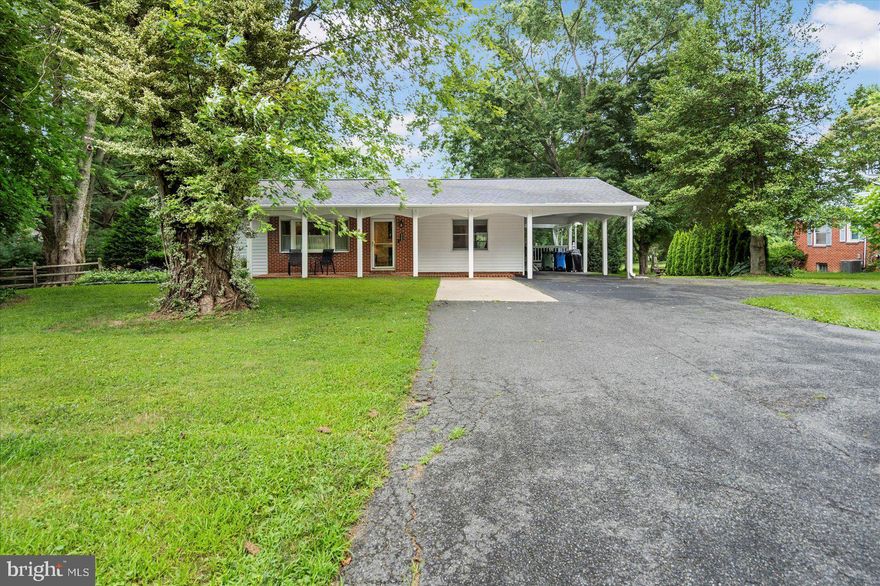 Spacious and private are two words to describe this 3 Bedroom  3 FULL Bathroom rancher situated on just about .70 acres with a brand new roof just installed in July.  Plenty of room to entertain, as this home has been the setting of an annual family reunion for many years.    The main level of the home has three bedrooms, one of which is currently used as a spacious walk-in closet.  You will also enjoy the convenience of two full bathrooms on the main level, one of which has been recently renovated to  include a standalone soaking tub.  In addition to the enormous eat-in kitchen with sitting room, there is a huge family room addition off the back of the home with a vaulted ceiling and direct access to the two-tiered COVERED composite deck that has stairs down to the fenced rear yard that includes a detached two-car garage and carport area along with two separate sheds.  What a great space for your extra storage needs, whether it be a boat, trailer, or whatever else you may have.   Head back into the house to check out the finished lower level with an open area currently set up as a fourth bedroom.  A third full bathroom is also sure to please.  There is a sizable unfinished storage room as well as laundry setup and direct access to the rear yard. For extra peace of mind, the sellers are including a one year home warranty.