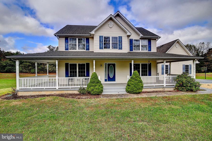 Charming detached Colonial with over 2,100 finished sq. ft. Beautiful wrap-around front porch with plenty of space for entertaining. 3 bedrooms and 2 full bathrooms. 1 additional half bath on the main level with pristine hardwood floors throughout. The kitchen has stainless steel appliances and a double oven, great for lots of baking! 3+ levels with the 2200 sq. ft. basement left unfinished - finish & make it your own! The house has a brand new AC unit. The lot sits on 3.9 acres with a 2 car garage and additional storage shed. Easy access to Rt. 9 & Rt. 340.