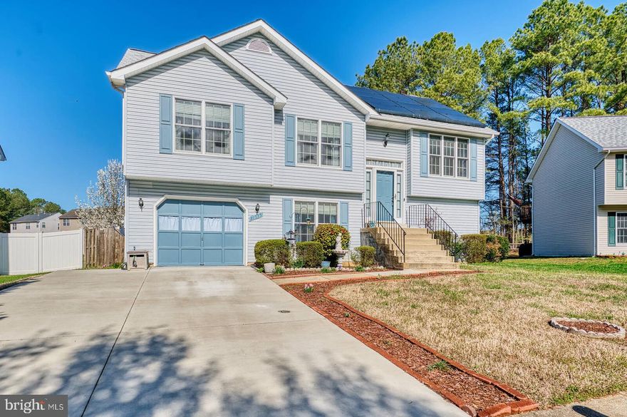 Location, Location, Location!!! This house is located minutes from Gate 1 NAVAIR PAX River and convenient to shopping, restaurants, grocery stores, gas stations, hiking trails, rivers, beaches, historic cities, etc.  This home has had one owner since 2002 and it has been well taken care of.  There are three bedrooms on the main level and one of the three is a primary bedroom with a primary bathroom and walk in closet.  On the lower level you will find the fourth bedroom.  The lower level is spacious and offers a wood burning fire place for warning up chilly evenings.  Also, on the lower level, you will find the full bathroom and laundry room with the conveying washer and dryer.  The  garage entrance into the house is from the lower level.  The house is situated on a cul de sac which cuts down the amount of traffic on your street.  The back yard is spacious and fenced in which provides privacy and an area to let the pets and/or kids play freely.  The features of the house are the solar panels (low electric bill),  large deck accessible from the  dining room, the garage, three full bathrooms and the fenced in backyard.
Also, the roof was replaced in 2021 and the A/C unit was replaced in 2017.  Come tour your new home!!