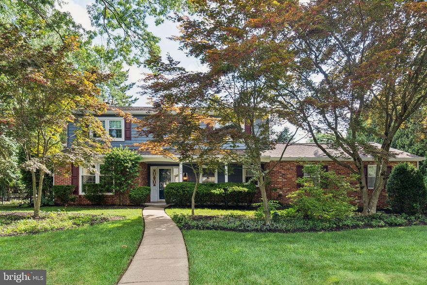 A Custom Home built by Betz back in 1970. This stunning two story Center Hall Colonial  sits on a quiet, tree lined street in the Heart of Huntingdon Valley.  Wonderfully maintained this spacious residence is bright. airy and comfortable with great character.  A flexible layout offers versatility, flow, convenience and a fabulous atmosphere.  
On the exterior the home boasts newer Colonial blue siding, a newer shingle roof both replaced in 2015 (roof has no sub layers). All the white vinyl windows were replaced in the same year.  The large extended front porch has plenty of room for your porch Rocker or Swing, just picture the possibilities.  
Enter the House through the front door to the open Foyer.  To the left of the Foyer is the Formal Living Room which allows for plenty of natural light. The original hardwood floors are gleaming throughout the Living room, up the stairs into the hallway and 4 bedrooms.  To the right of the Foyer is a Fantastic Dining Room which features custom American made ( Mid Continent) Cabinetry both base and overhead cabinets ( Domestic made & handcrafted).  Polished Italian Quarry Quartzite countertops, a wet sink and overhead lighting and a GE Wine Center & Beverage under the counter Wine Refrigerator.   The Magnificent Island also made with  Italian Quartzite counters, an American Standard Stainless Steel, extra long length Kitchen sink with Delta Soft Touch Faucets. A GE Monogram 48" Gas Range Stove with 6 Gas burners , Stove, Grill and Ge Louver External Exhaust vent.  GE Cafe' Series French Door bottom freezer Refrigerator and GE Cafe' built in Microwave.  The Kitchen flows around to a Cozy Family Room.  This room is filled with light & a full brick wall with Granite Fireplace Hearth with custom added bookshelves. What a Great room for Family gatherings or just relaxing at Home.  Continuing on the 1st floor you'll find a remodeled powder room, the main floor laundry, the entrance to the 2 car garage and a main floor bedroom with double closets.  Throughout the Kitchen/Family Room and extending into the 5th bedroom the floors are covered with durable, stylish , low maintenance Luxury vinyl plank flooring. 
Heading up to the 2nd floor you'll find the original wood flooring still in excellent condition.  On the 2nd floor are 4 very sizeable Bedrooms. The primary Suite is flooded with natural light, walk in closets, vanity area and Bathroom with glass shower stall.  The hall bathroom has been remodeled and has 2 sinks, extended vanity and glass shower and linen closet, Hall cedar closet.  All bedroom windows have either custom blinds/shades.  Down to the Finished "Party Room" with tremendous Handcrafted wet Bar, Loads of storage space behind the sliding closet doors. A 2nd room which can be the Playroom, Home Office or Study. In the corner of the basement sits the utility room with sump pump, split system Heat/Central Air conditioning and 200 amp electric circuit breaker box, brand new hot water heater 7/25.  You can also get into the garage from the basement, which was an added amenity when the house was built in 1970.  Finally, the Unbelievable, Stunning Landscape of this property.  The Exquisite Garden is filled with raised garden beds, perennials and annuals.  The Herb garden beds in the backyard have a French drain system, the water flows away from the house and down the slope. The Yard is fenced with a black wrought Iron fence installed by County Line Fence Co.  So many amenities... This House sits close to all major highways, shopping. Within walking distance to the Elementary School, The Train and Bus Systems.  Picturesque, Stunning, Impressive all describe this amazing Home...