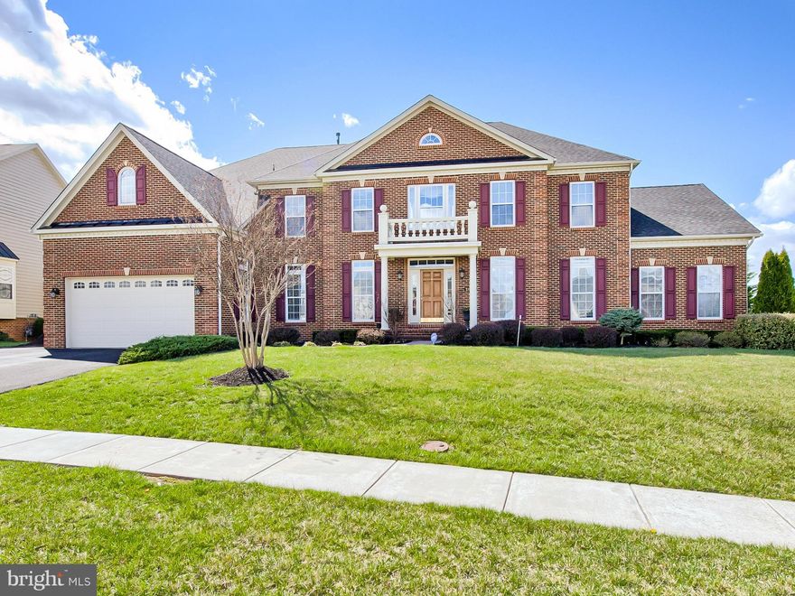 Stunning brick front manor home! 90% OF GREAT FURNITURE INCLUDED! 8,300+ fin. sq ft! 1st fl in-law suite: kitchen/private entrance. FR: huge  windows, mtn view, soaring ceilings, fireplace! Gourmet kitchen: huge granite island! Lux MBR suite: sitting area, claw tub, tile shower. Oversized bedrms--each w/bath, walk-in closet. Basement: fireplace, office, bath, media rm. Massive private brick patio!