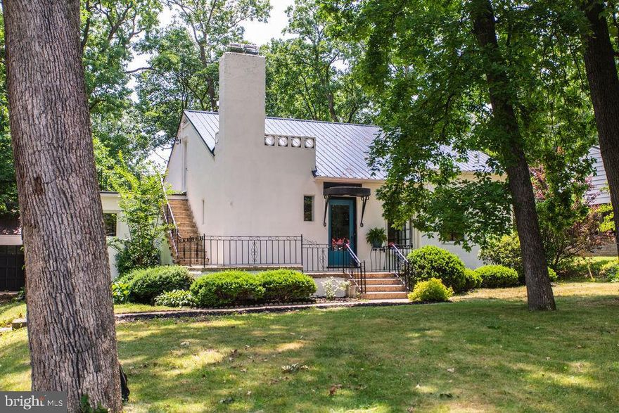 Welcome to this completely renovated home that feels like it has been touched by magic.   The beautiful large lot sets back from the road with grown trees that provide a little extra privacy.  You will immediately feel at home when you enter and take in all the well thought improvements and decor.  A large stone fireplace is a highlight to the living room which opens to stunning kitchen with a dining area that has a table perfectly tucked in view of the large dining window.  An oversized office sits opposite the other side of the kitchen which could also work as a formal dining room, playroom or your own specific need.  A large enclosed porch is off the back of the home.  The main floor also has a laundry area, one full bath and two bedrooms.  The second floor is a breathtaking primary suite which boasts a very large bathroom and private porch.  The basement has a great finished room for a family room and plenty of storage area.