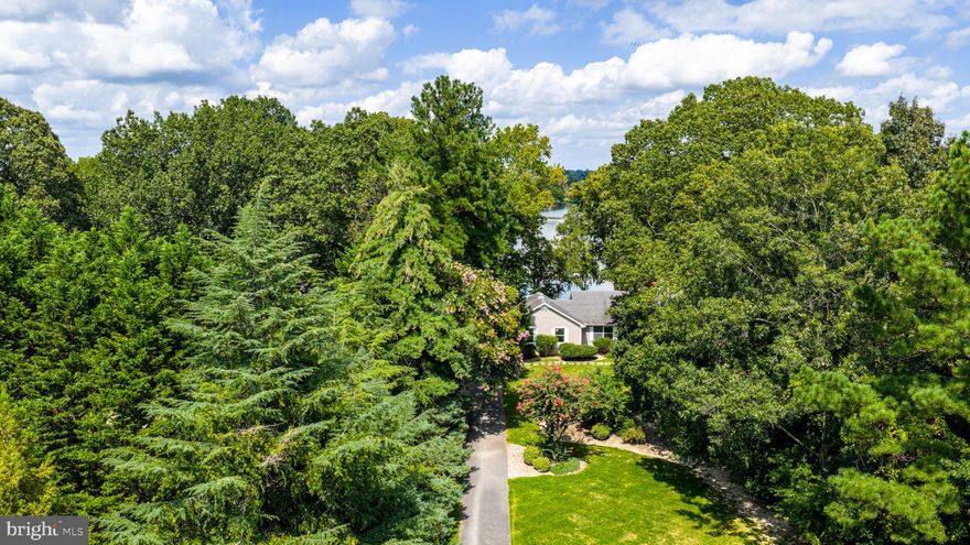 Tucked away in a private setting, this waterfront home offers a seamless blend of comfort and relaxation along the Tred Avon River. The spacious open floor plan features hardwood flooring throughout and is designed to take advantage of the stunning views. The main level includes three bedrooms and two full bathrooms, highlighted by a primary suite with a fireplace and expansive water views. The living room features a wood stove fireplace and direct access to the back deck, while the breakfast nook provides a perfect spot to enjoy the riverfront scenery. The lower level offers a versatile recreation room, an additional bedroom, and a full bathroom—ideal for guests or extended family. Outdoor living is enhanced by a private dock with a boat lift, providing easy access to the river. Whether you’re boating, fishing, or simply enjoying the natural surroundings, this property delivers the waterfront lifestyle.