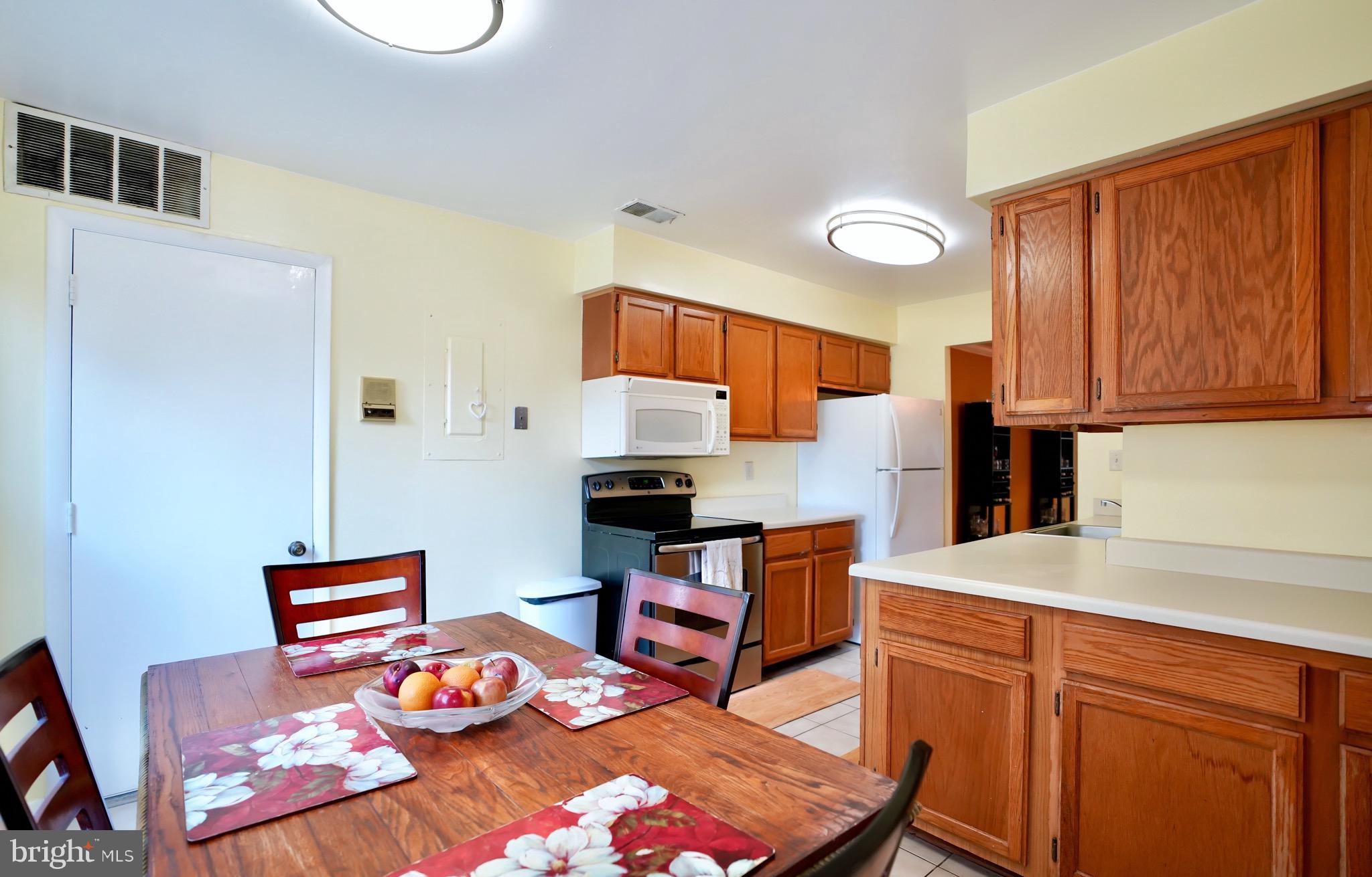Welcome Home! This Beautiful Lower Level Unit With Open Concept Provides Immediate Access to the Outdoor Areas of the Neighborhood as well as a Fenced in Private Patio. The Unit is Electric Throughout, has Tons of Storage and Reserved Parking with Plenty of Guest Spaces. Community Provides an Outdoor Pool, Playground and Clubhouse. Minutes to Major Commuter Routes, Milestone Center, Shopping, Dining, and Entertainment.