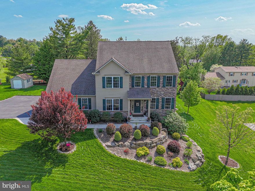 Experience elevated living in this like-new custom-built home, ideally situated in the highly sought-after East Penn School District. Designed for both everyday comfort and refined entertaining, this exceptional residence offers expansive living space, sophisticated finishes, and thoughtful upgrades throughout. Boasting 4–5 bedrooms, 2 full and 2 half baths, and multiple living areas, this home delivers versatility and elegance at every turn. The heart of the home is a chef-inspired gourmet kitchen, featuring GE Profile Elite appliances, a gas cooktop, granite countertops, custom tile backsplash, and sleek gray shaker cabinetry. A spacious breakfast area filled with natural light, a walk-in pantry, and a refrigerator with a built-in Keurig elevate both function and style. The main level showcases rich hardwood flooring, detailed crown molding, and a seamless flow between formal and casual spaces, including a beautifully appointed family room with a gas fireplace and a flexible living room currently styled as a private home office. Upstairs, retreat to the luxurious primary suite, complete with a tray ceiling, expansive walk-in closet, and an additional closet for optimal storage. The spa-like ensuite bath features a custom tile shower, soaking tub, and dual granite vanities, creating a serene, retreat-style experience. Generously sized secondary bedrooms with walk-in closets and upgraded finishes provide comfort and privacy for family and guests alike. The fully finished walkout lower level with 8-foot ceilings offers exceptional bonus space, perfect for entertaining or multi-generational living. Enjoy a spacious recreation room with fireplace, dedicated game area, fitness room, additional bedroom, and a half bath, plus over 400 square feet of storage. Additional highlights include custom blinds, upgraded lighting and ceiling fans, premium Moen fixtures, Dreamweaver carpeting, and a well-designed laundry/mudroom. Perfectly positioned near major highways, healthcare, upscale shopping, and dining, this home offers the ideal balance of luxury, convenience, and lifestyle. This is more than a home; it’s a statement. Schedule your private showing today.