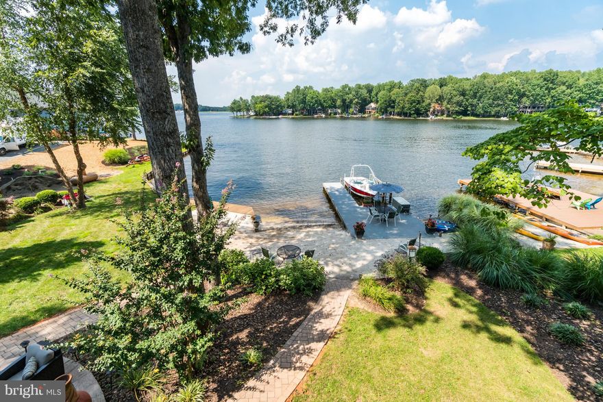 PRICE IMPROVED on this truly Magnificent WATERFRONT like this is a Rare Find!!!  You will be Mesmerized when you Walk thru the Door by the FABULOUS Views!!! Welcome Home to 232 Beachside Cove. Nestled at the Mouth of one of Lake of the Woods Premier Coves on the Main Lake. Lounge on the Beach or Multiple Outdoor Living Spaces and Enjoy all that Lake Living has to Offer!! Truly a Custom Experience featuring updated Kitchen with Granite Countertops, Stainless Appliances, Bamboo Flooring, 100 year roof, Docks, Boat Lift, Decks, Screen porch, Two Master Suites!!! What more could you Want? Located in Amenity Filled Lake of the Woods with so much to offer you Feel like you're on Vacation Every Day!!! Community Pools, Fitness Center, Lakes, Clubhouse with Fabulous Outdoor Dining, Golf Course, Golf Clubhouse, Community Center, Tennis Courts, Pickel Ball! You name it, it's here! You'll never have to Leave!!! Come take a Look at this Fabulous Home Today and Experience it for yourself!!!