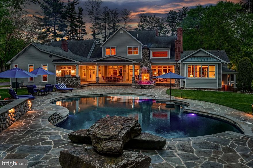 Live Authentically. Revel traversing the secluded lane to your gated oasis. Cross the threshold and come home. The mountain modern aesthetic lives within strong classic architectural lines. The attention to detail is palpable from the moment you open the car door and are caressed by your soothing sound system. Masterful renovations in both 2008 and 2022. Your visions for living are realized. Lush landscaping embraces and soothes from every vantage point. Truly epic outdoor living crafted for ultimate sensory experience... an elemental symphony. Fire, water, wood, glass, stone, and light all come together... a mesmerizing effect. Be inspired to create on your Kalamazoo Hybrid 900 grill. Lounge and dip in your custom sparkling 57,000-gallon self cleaning IntelliChlor Mineral Springs pool. Seamless indoor, outdoor connectivity that resonates throughout. A chef’s cooking space ergonomically designed. Enduring copper and river rock, custom concrete countertops and sinks with Sepele in-lay. Stunning great room with rustic cedar beams anchored by a 16-foot roaring river rock fireplace. Experience the visual poetry of this captivating space. Chestnut floors set the tone for a sumptuous and tranquil owner's suite, where bathing and dressing transform your morning journey. A copper tub that redefines soaking. Radiant heat, walnut vanities, and onyx countertops... texture abounds. The lifestyle experience continues as you immerse into the lower level.  Lose yourself in the state-of-the-art theater with fiber optic sky ceiling. Channel your inner oenophile with 1,000 bottle wine cellar. Enjoy lighthearted endeavors with friends... billiards, game room, and one-of-a-kind hockey/sports room. Incredible location, just minutes from everywhere you want to be. Convenient access while feeling worlds away. See additional documents for more details and seller's amenity list. Cultivate your existence. The art of uniting human and home.