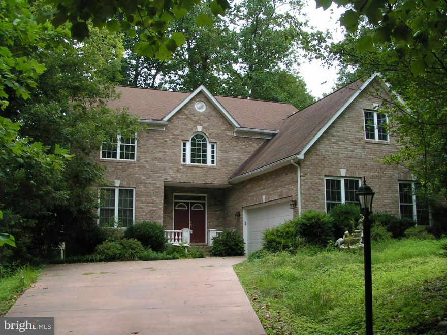 BEAUTIFUL BRICK FRONT COLONIAL WITH 3 FULLY FINISHED LEVELS AND TONS OF ROOMS FOR EVERYONE. 4 BDRMS, 2 BTHS LAUNDRY AND A BONUS SPACE ON UPPER LEVEL, LARGE LIVING, FAMILY RM, FORMAL DINING, OFFICE, BRKFST AREA, SCREEN PORCH ON MAIN, AND FULLY FINISHED BASEMENT W/ 2 ADDTNL BDRMS AND BTH ALL ON OVER AN ACRE LOT. SEASONAL WATER VIEWS, AND MINUTES FROM PAX RIVER, SHOPPING AND SCHOOL. PARAGON BUILT!!