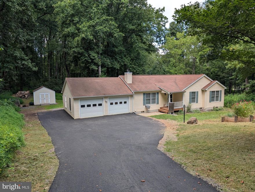 This charming 3-bedroom, 2-bath home offers 1,368 sq ft of living space plus a spacious 550 sq ft finished rec room—perfect for movie nights, a home gym, a new hobby, or get togethers. The gorgeous atrium/sunroom allows you to enjoy the beauty of nature in all weather and all seasons. The kitchen has been updated with new countertops, faucet and microwave. The living room has ample space to store your library collection in the built-in bookshelves and cabinets. Down the hall to the bedrooms, you will find a centrally located renovated laundry area containing a new washer, dryer and water heater along with sufficient shelving for linen storage.

Retire in the evening to a large primary bedroom with a spacious walk-in closet and in-suite primary bathroom. Two additional bedrooms look out at the beautiful, raised garden beds in the front yard. All bedrooms contain ceiling fans for your comfort. All bathrooms have been updated with stainless steel detachable shower heads and curved shower rods for more elbow room. The HVAC has been retrofitted with a MERV12 whole home filter and a UV disinfection system. This no-pet home is perfect for those with allergies or other sensitivities.

Step outside to 1.14 acres of beauty nestled in a mountain forest. Enjoy nature from a new deck facing the back meadow, a freshly paved driveway, and a front yard with a large, raised garden and a small orchard including 12 local favorite native paw-paw fruit trees, ready to enjoy this September! Additional storage space can be found in the substantial 12’x16’ shed. Lawn mowing is included April–October, so you can spend more time relaxing and less time working. Plenty of wildlife abounds in this nature’s haven.

This home is located in the highly desirable High Knob gated community featuring a clubhouse, community swimming pool, playground and pickleball/tennis courts. High Knob also has direct access to the Appalachian Trail, great for hiking enthusiasts. Additionally, commuting is a breeze with easy access to exit 13 on I-66.

Details:
- 3 bedrooms / 2 bathrooms
- 1,368 sq ft + 550 sq ft finished rec room
- New deck & paved driveway
- Raised garden & 15 fruit trees
- Lawn mowing included (April–October)
- No pets allowed

High Knob offers the perfect blend of privacy, community, and convenience—ready for you to call home.