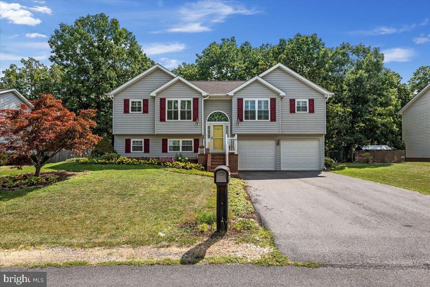 Welcome to this meticulously maintained custom built home that is convenient to the I-81 corridor, shopping and businesses, yet is tucked away in its own little neighborhood.  As you enter the home, the upper level is ceramic tile throughout, with laminate in the owner’s suite.  The open and airy living room/dining room/kitchen area is bright and inviting with new double hung windows graced with plantation shutters for a charming look.  The chef friendly kitchen has upgraded newer SS appliances including a gas range.  The center hinged French door opens to the back deck where you can enjoy grilling and hanging out watching the wildlife.  Back inside, there is a full hall bath on this level and one secondary bedroom and the owner’s suite, which has a walk-in closet and an upgraded ensuite with an extra-large shower sporting a rain shower-shower head.  The lower level is mostly finished with another legal bedroom and a half bath.  The washer/dryer area and unfinished storage space completes this level with a walk out to a lovely patio and the fully fenced tiered garden with a delightful bird bath.  A very generous sized garage allows for work bench space and more storage if needed.  The property backs to trees and has a little creek at the bottom of the lot.  French drains are installed.  This is a delightful home that has been lovingly cared for by the original owner.  **Heat pump 2021; Roof 2018 with 50-year architectural shingles and a transferable warranty; Windows 2022**