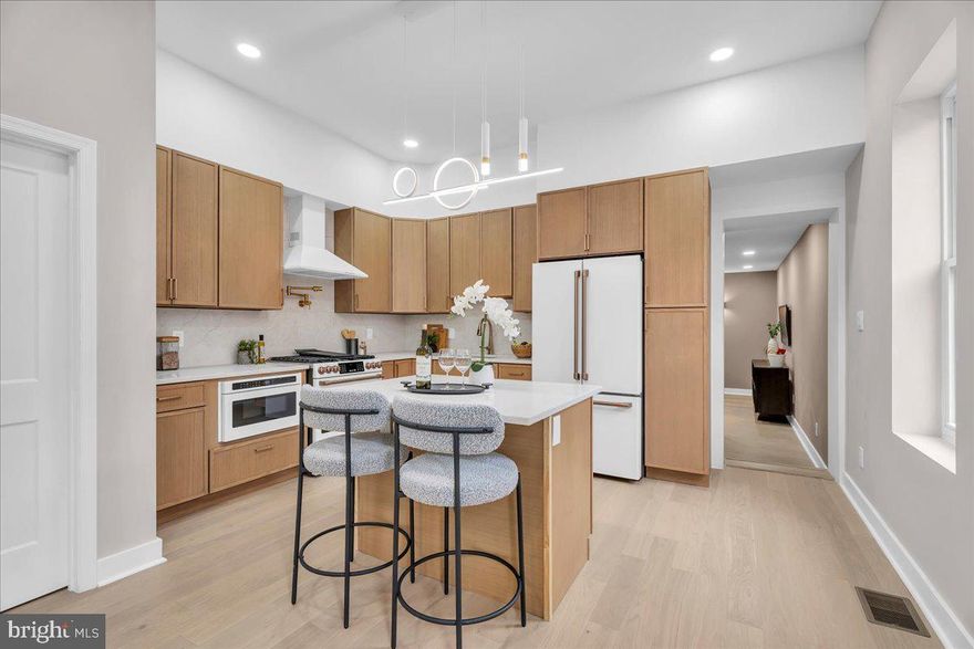 Welcome to this stunning 4-bedroom, 2.5-bath home on a sunny corner lot in East Passyunk. Completely gutted to the studs with a brand-new third-story addition, this home offers over 2,700 sqft of thoughtfully designed living space and luxury finishes throughout.

The main level features an open layout with high ceilings, a chef’s kitchen outfitted with GE Café appliances, quartz countertops, custom cabinetry, and it is flooded with natural light. Just off the kitchen, you’ll find a spacious den/movie room, laundry, and a convenient half bath, offering the ideal setup for casual lounging, a playroom, or a home office.

Upstairs, there are three bedrooms and a full bath, while the third floor boasts an enormous primary suite with a spa-inspired bathroom, walk-in closet, wet bar, and access to a private rooftop deck. A partially finished basement adds even more flexibility for a gym, studio, or extra living space.

With two outdoor spaces, luxury finishes throughout, and tons of natural light from its corner positioning, this home delivers on every level. Its mechanicals and appliances have all been updated, and a second HVAC zone was added, giving buyers a true turnkey experience. Best of all it has the 10 year tax abatement, AND it is just a short stroll to Stogie Joe’s, Barcelona Wine Bar, and the countless local gems that make Passyunk Square so special.