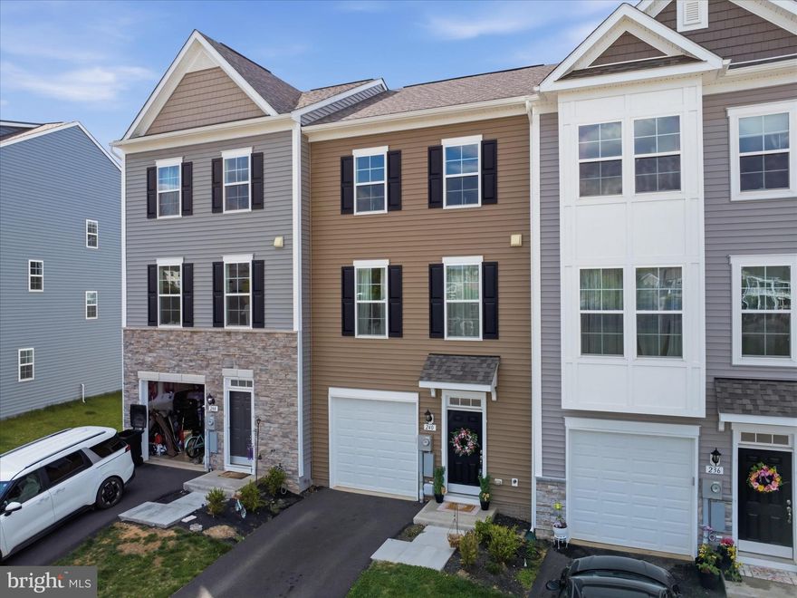 Why wait to Build - when this home is practically new. Beautiful Townhome in the sought after community of The Martinsburg Station. This community offers Pool, Clubhouse, Walking Trails, Pickle Ball/Tennis courts, Basketball Court, and Playground. This home is 3 Bedrooms, 3.5 Baths and incredible well taken of. The foyer includes a double coat closet that leads into a finished rec room with a full Bath. Foyer with boxed oak staircase that leads to an open concept main level. The kitchen comes with complete stainless steal appliances, Upgraded cabinets, over sized island, quartz countertops, and powder room. Another boxed oak staircase that leads to a primary suite, large walk-in closet, bathroom with dual vanity, and oversized shower with seat. Laundry is also located on the bedroom level. Additional 2 bedrooms and a full bath. This home has a 1 car garage.