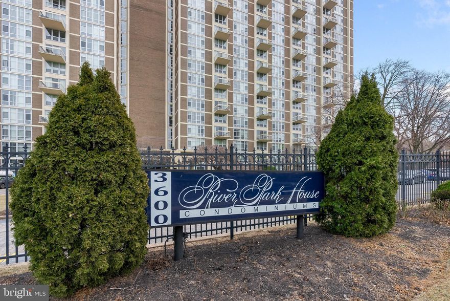 Serene tree-top views, a well-kept building with lots of amenities, and a convenient location set against sprawling Fairmount Park, just off City Ave, combine for easy living at River Park House Condominiums. Unit #905 is a large, updated corner condo with 3 bedrooms, 2 full bathrooms, a new kitchen, in-unit laundry, and central a/c. Sought-after building amenities include a welcome desk staffed 24/7, on-site management and maintenance, a gym, a library, and an event space. Covered parking and pool access are also available for a fee. This unit's layout features an expansive living room at its center with a picturesque wall of windows that creates an open and airy feel. Modern floors stretch into the separate dining area, where stunning views are always on the menu, and into a brand-new kitchen fitted with plenty of shaker cabinetry, stainless steel appliances, including a dishwasher and gas range, granite counters, and a subway tile backsplash. On one side of the unit is the spacious primary suite with an attached full bathroom and laundry. Two more bedrooms and a second full bathroom are on the other side. All have floor-to-ceiling windows and generous closet space. In addition to everything inside, this fantastic location is close to popular shopping centers with stores and restaurants, like Target, Fresher Grocer, Chick-fil-A, Honey Grow, and Olive Garden. Extensive walking trails are steps away, plus there's easy access to public transit, I-76, Rt-1, and Lincoln Drive. Schedule your tour today!