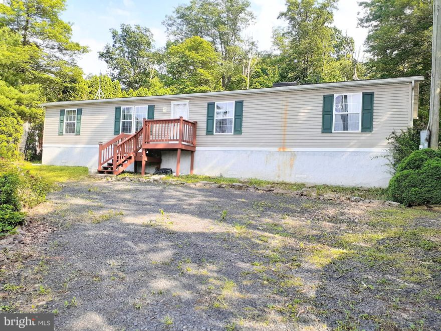 Manufactured home on a concrete foundation ( crawl space type foundation ) in good condition.  3 nice sized bedrooms, living room with vaulted ceilings and convenient first floor laundry off the kitchen.   There are several skylights which make for a light and breezy feel in the home.