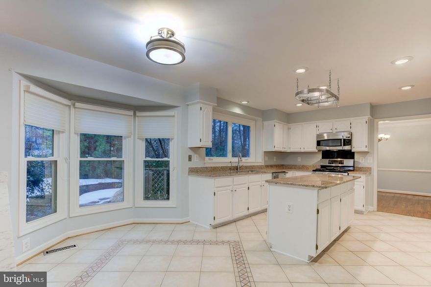 This beautiful, meticulously maintained home with over 3000 finished square feet on three levels is nestled in a private setting away from traffic and noise but is just minutes from the Franconia/Springfield Parkway, Springfield Metro, 95/395/495, bus routes and Fort Belvoir.  This neighborhood enclave of homes offers a tranquil respite yet is close to many shopping areas, restaurants and conveniences.   You can enjoy just watching nature from the front and back porches and patio in the peaceful environment.  There are so many updates -- Primary Bath 2023, Roof 2025, Front Walk 2025, Furnace 2025, Refrigerator 2022, Water Heater 2020, AC Compressor 2019, Family Room Updates 2018, Upper Level Bath 2015, Fresh Paint 2026,  Garage Door Opener 2026, 2" Blinds in Primary 2026.  All dates are approximate.  This home also features Replacement Windows, 6 Panel Doors, Granite, Wine Fridge, Large Pantry, Skylights, Hardwoods, Crown Moulding and Large Bedrooms.    This is a fabulous price for this home.  Two sales in this neighborhood in 2024 and 2025 were $1M-$1.1M.