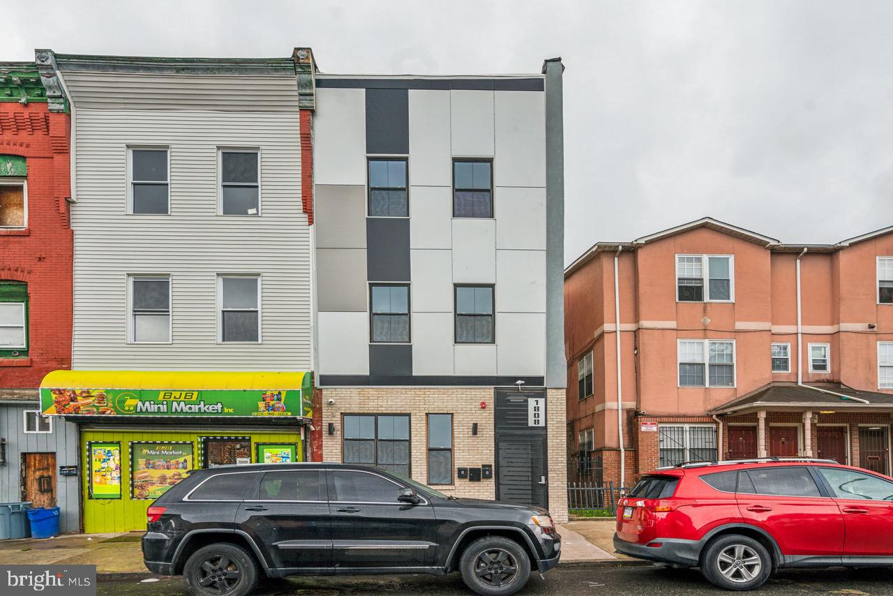 Excellent investment opportunity with this mixed use triplex in the Temple University section of Philadelphia. Unit #1 is a large vanilla shell commercial space, with basement access for additional usable SQFT. Units #2 & #3 both offer large 2bed 2bath apartments. The property has undergone a full renovation, with all new plumbing, electrical, mechanicals, etc.. Each residential unit has tasteful finishes and modern amenities such as central air, in-unit full size washer and dryer, chef's kitchens, tiled bathrooms and much more. Tons of growth, development and upside potential here. Whether you're looking for an investment opportunity or to owner-occupy with rental income, this triplex is the perfect choice. Proforma available upon request