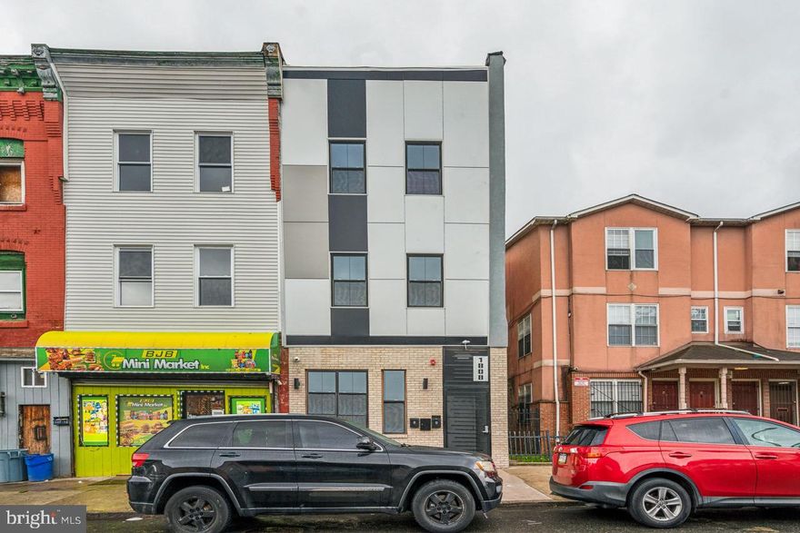 Excellent investment opportunity with this mixed use triplex in the Temple University section of Philadelphia. Unit #1 is a large vanilla shell commercial space, with basement access for additional usable SQFT. Units #2 & #3 both offer large 2bed 2bath apartments. The property has undergone a full renovation, with all new plumbing, electrical, mechanicals, etc.. Each residential unit has tasteful finishes and modern amenities such as central air, in-unit full size washer and dryer, chef's kitchens, tiled bathrooms and much more. Tons of growth, development and upside potential here. Whether you're looking for an investment opportunity or to owner-occupy with rental income, this triplex is the perfect choice. Proforma available upon request