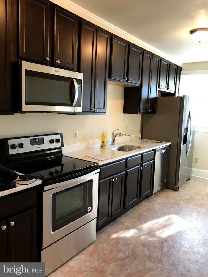 Honey Stop the car!!! Got to see this. Renovated home NEW!! Open Floor Plan. New Windows Dream Kitchen with New Cabinets, Granite Counter top and Upgrade Stainless Steel appliances. One Car garage. Off Street Parking. Huge yard for family cookouts. Move in Ready.  Will Not Last. Hurry!!