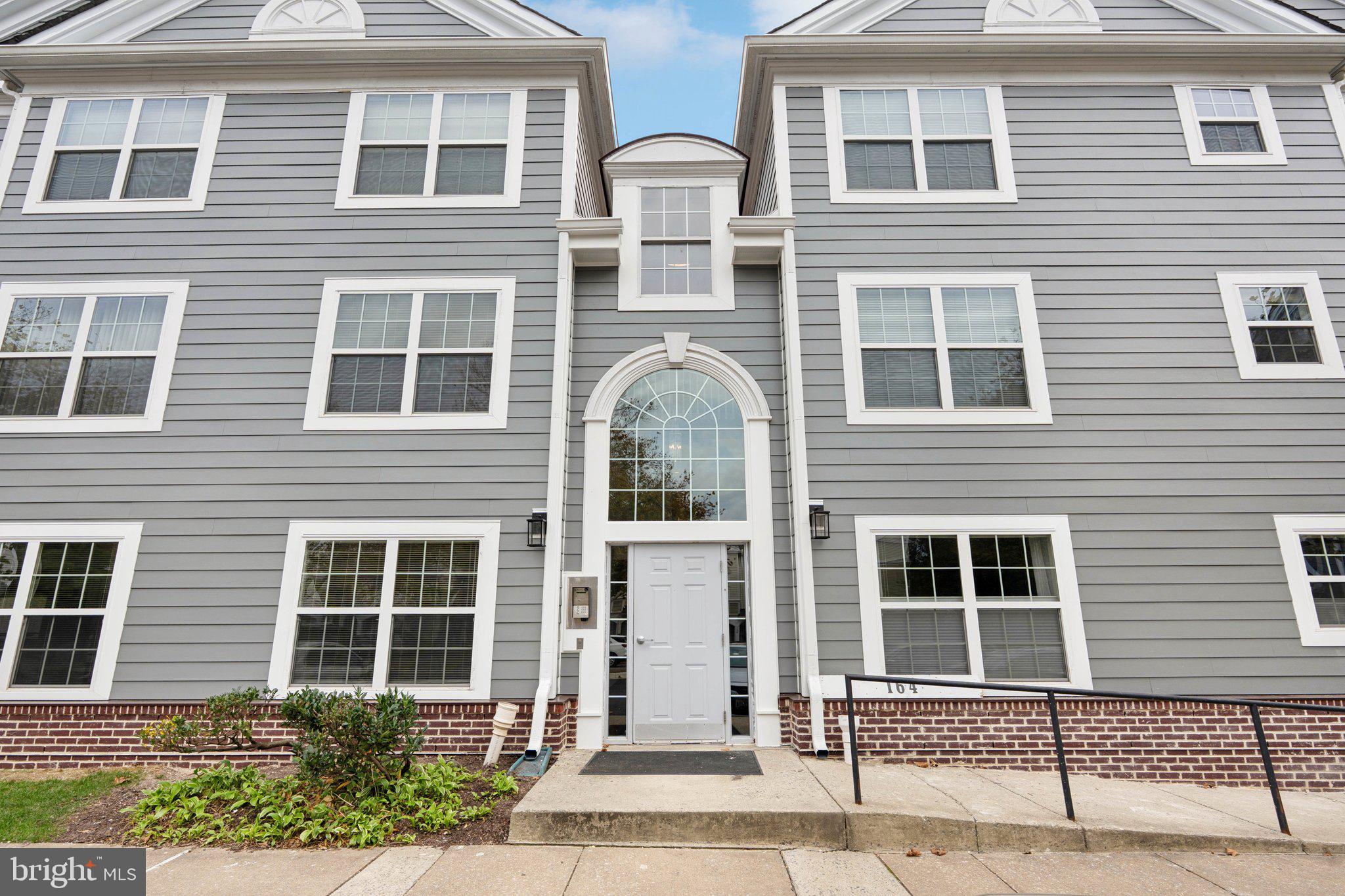 Welcome to 164 Kendrick Place nestled in the sought after community of Kentlands Ridge. This beautiful condo offers 1,095 square feet of first floor living space, providing an abundance of natural sunlight and a charming open space for comfortable living. The large and open concept living area includes a cozy fireplace with sliding glass door opening to the private side patio. The two bedrooms and newly renovated ensuite bathrooms are on opposite sides of the unit from each other for optimal privacy. The fully equipped kitchen boasts white cabinetry, granite counter tops, and new stainless steel appliances. There is a breakfast bar area for informal meals and a dining area for formal meals. The community swimming pool, on-site gym, basketball courts, lighted tennis and pickleball courts are just some of the ammenities included. Assigned parking and washer and dryer located in the unit. The community offers an impressive range of amenities, dining options, retail stores, and vibrant spaces like the Arts Barn, community green space, walking paths, sports courts, playgrounds and lakes. The unit is located in a secure building with controlled access, providing peace of mind and privacy. Don’t miss!