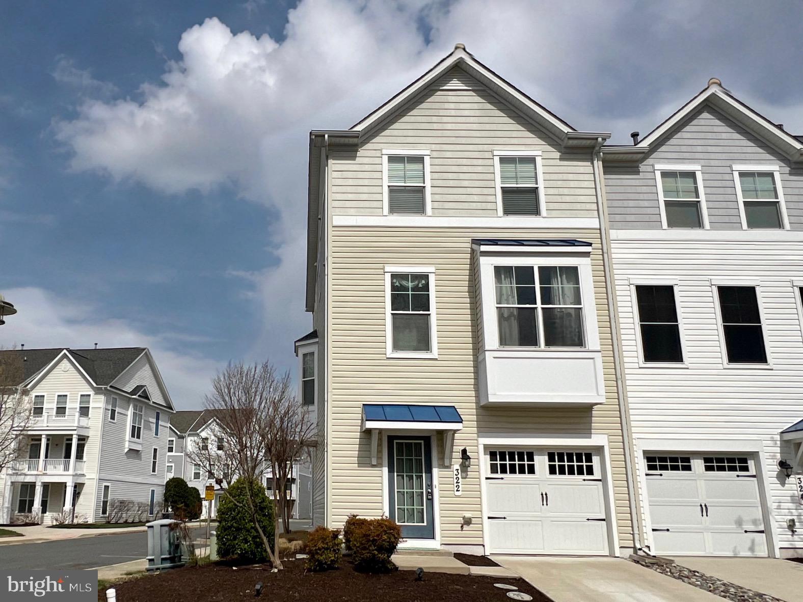 Your Eastern Shore dream home WITH A DEEDED BOAT SLIP awaits and is priced to sell in the gated community of Deep Harbour in historic Cambridge, Maryland! This large end unit located just steps from the community pool complex features over 2,400 sq ft of sunlit living space with high ceilings, custom window treatments, a large owner's suite, and ample free parking across from your private driveway and garage! This meticulously maintained former model home is owned by the original owners. The spacious living area on the second level is bathed in sunlight from the many large windows and a bay window bump-out. Ceramic tile flooring lines the sunroom and eat-in kitchen with island, stainless steel appliances, and large pantry. Updated wide plank LVP flooring completes the living room with multiple seating areas for entertaining or relaxing, a half bath and closet for storage. The top floor has 3 bedrooms with recently installed carpet and 2 full bathrooms connected by a hallway with LVP flooring and a linen closet. Decorating options are endless in the owner's suite that includes a sitting area with large windows adorned with custom window treatments including blackout blinds, a walk-in closet, and a bathroom with double sinks, a soaking tub, and a walk-in shower. Recently installed berber carpet lines the wide stairways leading from the hardwood flooring greeting you at the entry in the foyer. The first floor features a half bath and a den/guest room along with an exercise room/office with slider to the back patio and community pool, as well as the laundry and utility closets, and access to the large garage with storage area and brackets for your paddelboard and bikes. It's a quick walk or ride to the marina and riverwalk where you have private access to your own deeded boat slip (Slip #3) with association-provided water and electric where you can dock boats up to 33 feet in length. So in addition to enjoying all of the Deep Harbour community amenities, local Cambridge shops and restaurants, and nearby parks and beaches, you can enjoy boating on the Choptank and Chesapeake from your own slip! Whether you're looking for a relaxing vacation home, a homebase for coastal adventures from the Bay to the Ocean, or a poolside escape, you'll have ample free time to enjoy it all with no lawn maintenance and security features like an in-house sprinkler system, alarm system , and fire hydrant right out front all within the gated community. Homes with deeded boat slips aren't often available so visit 322 Shipyard and Slip 3 at the marina today! Monthly water and sewer is a flat rate of $73,20; see list for additional inclusions; a capital contribution fee may apply; your agent can share information on amenities, HOA/Condo fees, and deferred water/sewer payments from disclosures. All measurements listed are estimated by CubiCasa; buyer and their agent to confirm all measurements, fees, association requirements, tax and school information.