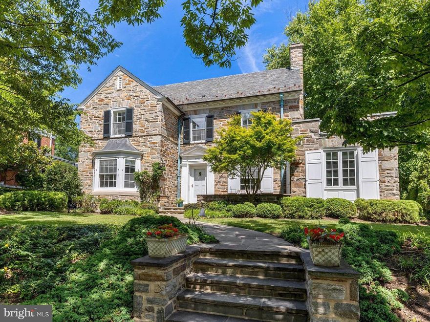 Live authentically. Tucked away on one of Guilford's quietest streets, this light-filled stone stunner is anchored with copper patina and endless charm. The perfect blend of timeless and current. Bright, generously sized rooms with great flow. Spacious updated kitchen with Sub-Zero refrigerator, 5-burner cooktop and tons of storage. Stunning statement window overlooking lush backyard greets you as you step upstairs. Primary suite with beautifully updated bathroom is wrapped in windows and filled with sunlight, complete with private rooftop balcony. Second floor includes two additional bright and spacious bedrooms with shared bathroom. Fabulously finished third floor with bedroom, office space and full bathroom. Downstairs, finished lower level with exposed stone and rich paneling offers additional family room and rec spaces complete with stone fireplace and bar. With thoughtfully designed shelving and cabinetry, there is no lack of storage in this home. Charming Dutch door leads out to covered portico, attached garage and incredibly private backyard. Gorgeous stone patio surrounded by gardens and specimen trees, followed by an open grassy area and then tucked just around the corner is a surprise playground for the little ones. A home that has it all, right down to the fantastic walkability. Cultivate your existence. The art of uniting human and home.