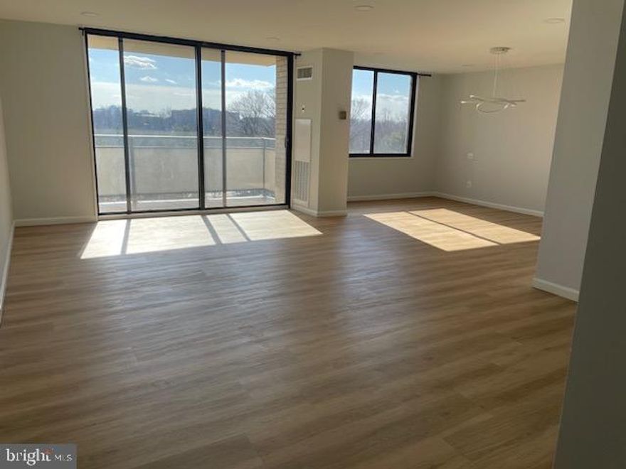 This apartment is stunning and has been so beautifully renovated with a light, contemporary style.    Ashen strip floors and recessed lighting throughout.  Plenty of storage.  Huge foyer closet which houses the washer/dryer.   Balcony off the dining room with view of trees and tennis courts.   Gourmet kitchen has white to the ceiling cabinets,  beautiful counters and backsplash, and all LG stainless appliances.  Gorgeous modern dining room chandelier.    Ceiling fans in both good sized bedrooms.  Both bathrooms have bidets, great shower heads, shelves in the shower and beautiful tile,   In addition, the primary bathroom has a walk-in shower with a seat and a built-in glass shelf unit.  Garage space included.  Plenty of outdoor parking available or rent a 2nd garage space from another resident.  The Promenade has a great number of  amenities and activities making it feel like resort style living.  The recently redecorated Arcade level has the state of the art fitness center with indoor pool and hot tub:  locker rooms with showers and sauna.   Also in the Arcade is Chef Tony's restaurant (a well known seafood/Italian eatery), a grocery store/deli, dry cleaners, travel agent, beauty salon resident lounge party and conference rooms.  There is a large outdoor pool with adjacent grills.  Tennis and pickleball have their own building as you drive onto the property.  Ping Pong is played regularly, as are social activities such as "Breakfast at Wimbleton".  There are too many activities to mention them all.  A few are.....trivia night, open mike night, monthly first run movies, lectures, vaccinations, vote in all elections in the party room (including Presidential).  There is meditation, exercise class, book club, canasta, bridge and majhong.   We have wine and cheese get togethers in the lobby, a New Years Eve party and various other celebrations.  It is easy to get to the Red Line Medical Center metro stop at NIH/Water Reed.   The bus comes to the door of the Promenade.  Close to 495 and 270.  Nearby Wildwood Shopping Center has Balduccis, CVS, Bethesda Bagels, Starbucks, a number of places to eat and several cute boutiques.  Giant food is just across the street.