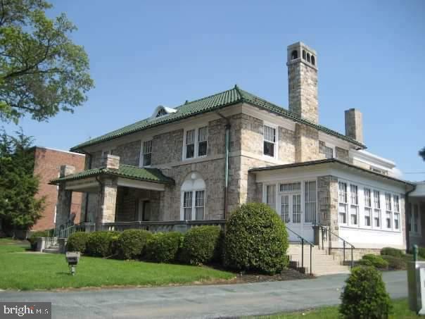 You will be amazed at the splendor of the original woodworking of this stately home. It was custom built as a residence, but later became its current use which is a funeral home. The hardwood floors under the carpet are in immaculate condition. The zoning is CN which qualifies this building for just about any business. There is a 3 BR apartment on the 2nd floor which makes this building perfectly suited for an owner occupied business qualifying for 30 residential fixed rate financing with one of our partner lenders. There is a permitted use sheet in the associated documents folder. In addition to the more than 5,000 SF upstairs, there is over 3,200 SF of finished basement suitable for offices or storage. There are only 2 small rooms that will be off limits: There is also a 2-car detached garage with access from the rear alley for parking or additional storage. The smallest bedroom upstairs which will be housing the family pets and a first floor room. Both will be made available during due diligence. Not hiding anything, just for privacy. Business not included in the sale.
