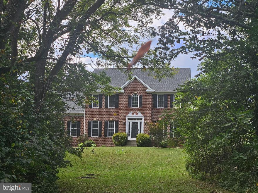 Exquisite Colonial Home on 3+ acres in Historic Middletown VA. Traditional Floorplan with 4 Bedrooms 2.5 Baths and Partially Finished Basement   Basement has rough in for bathroom and some supplies are there to finish it.  Entering the home, you have a foyer, formal living room space/office, which ever you prefer. There is a full dining area with hardwood floors leading into the open concept kitchen area and has upgraded appliances and granite countertops. Additionally, there is a beautiful sunroom area that can be used as a sitting area or a dining space and has a beautiful view of the open back yard area. The family room is cozy and has a fireplace. The upper level has a large primary Bedroom with a large walk in closet and sitting room. The primary bath has a walk in shower and soaking tub.  There are 3 additional bedrooms and 1 additional bathroom in the upper level. The laundry is also on the upper level. The basement is almost completely finished with a recreation area, currently a movie area and work out area. There is a utilty/storage room
and a room rough in for a bathroom.  The internet is Starlink. The exterior is naturally  beautifully 
landscaped with mature trees and large boulders and rocks.  Close to commuter Rt 81, 11 and 66!  The well pump is newer and water tank is newer.  Professional Pictures on the way